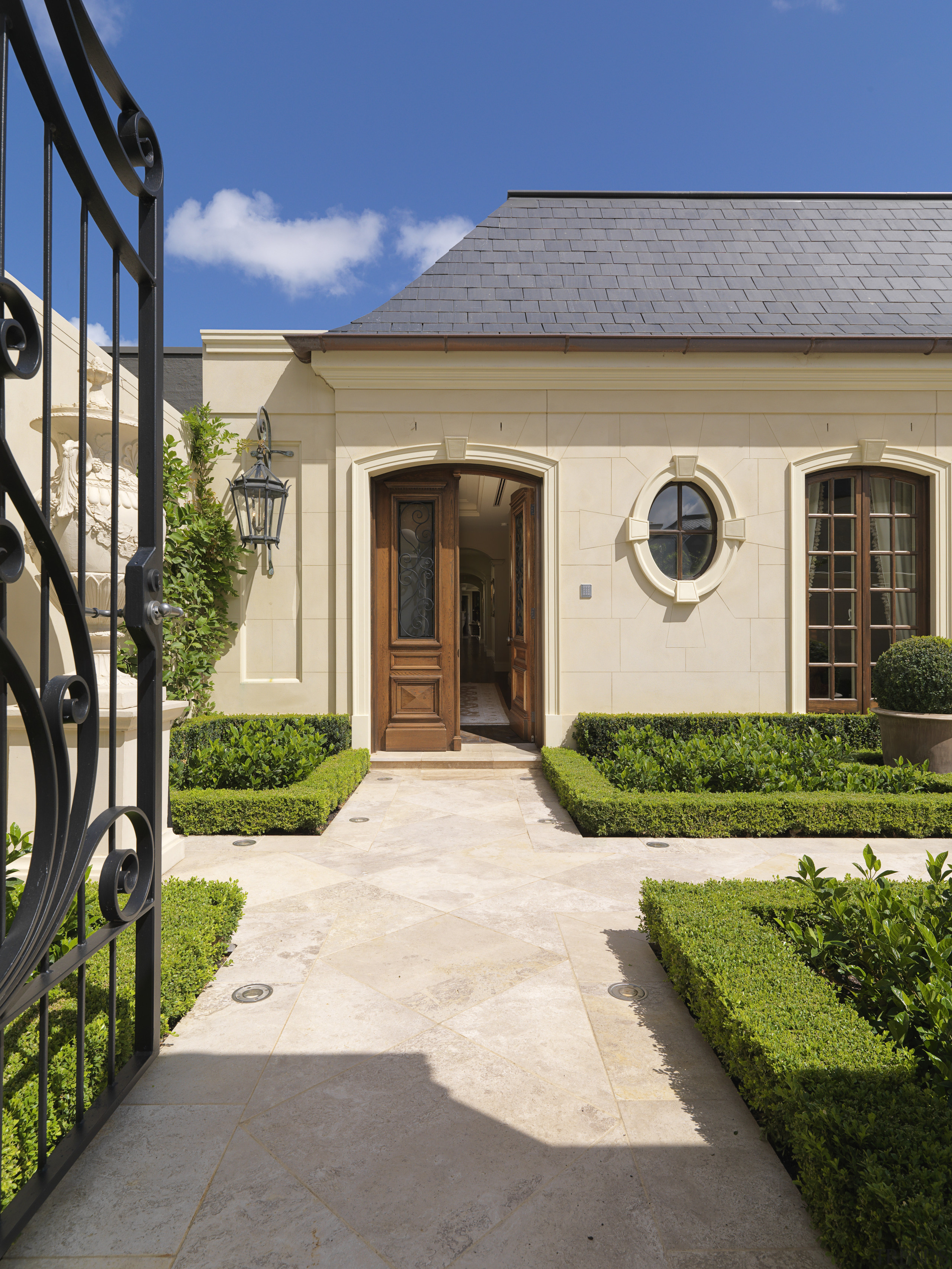 Overview of the entrance of this home - courtyard, estate, facade, home, house, landscaping, property, real estate, residential area, walkway, window, yard