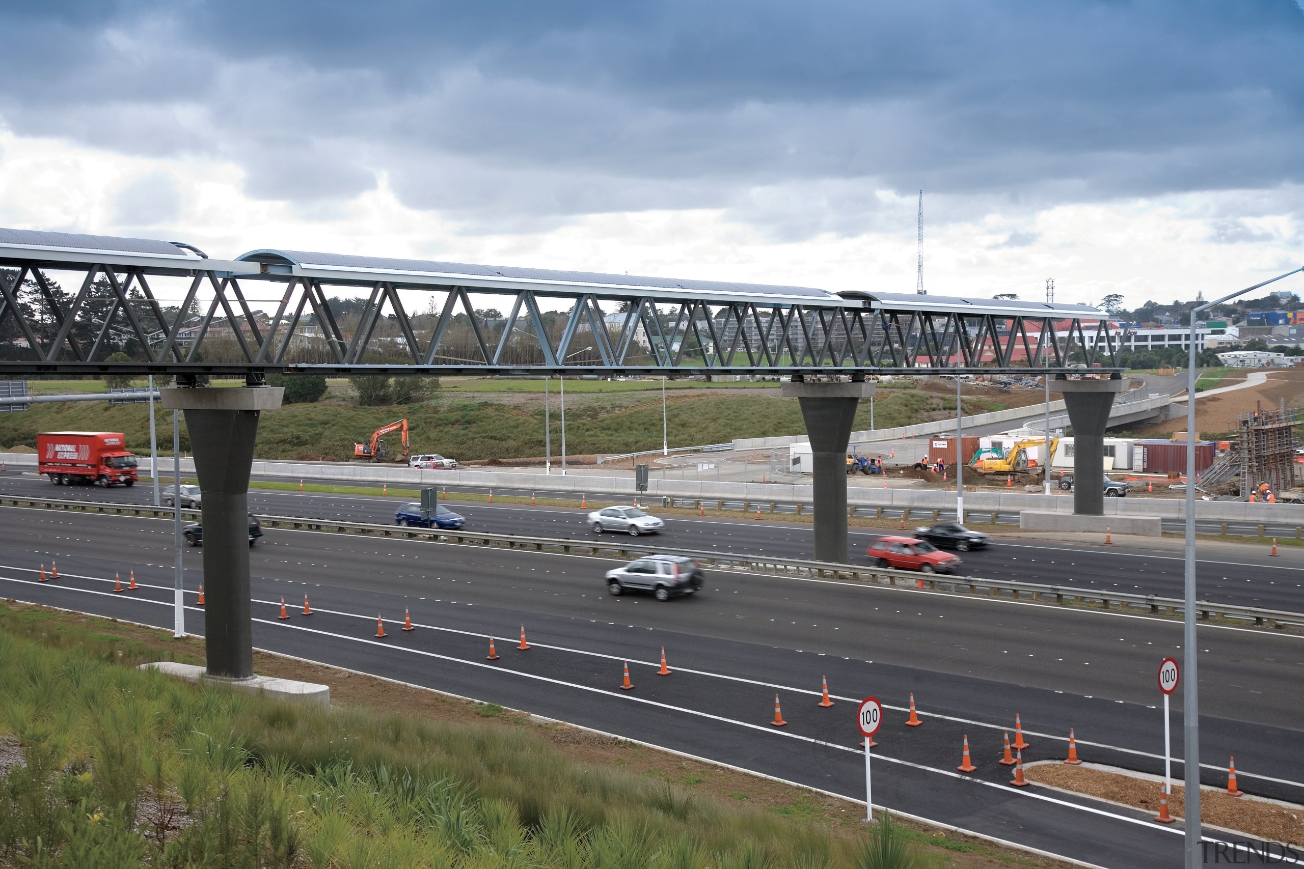 A view of some work done by Auckland bridge, car, controlled access highway, extradosed bridge, fixed link, girder bridge, highway, infrastructure, lane, metropolitan area, overpass, road, sky, skyway, transport, urban area, gray