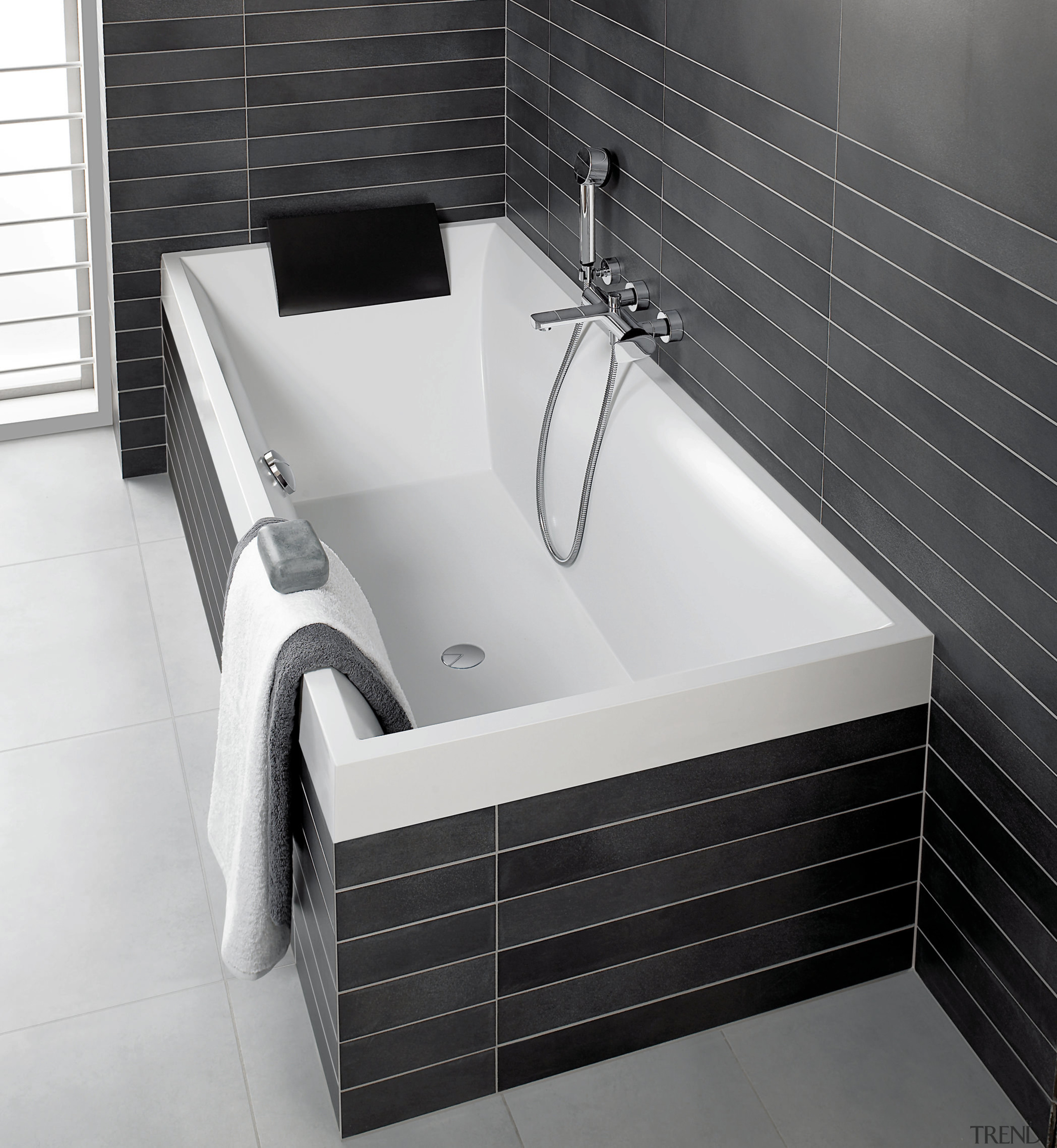 View of a bathroom which features a bathtub angle, bathroom, bathroom accessory, bathroom sink, bathtub, floor, plumbing fixture, product, product design, sink, tap, tile, white, black