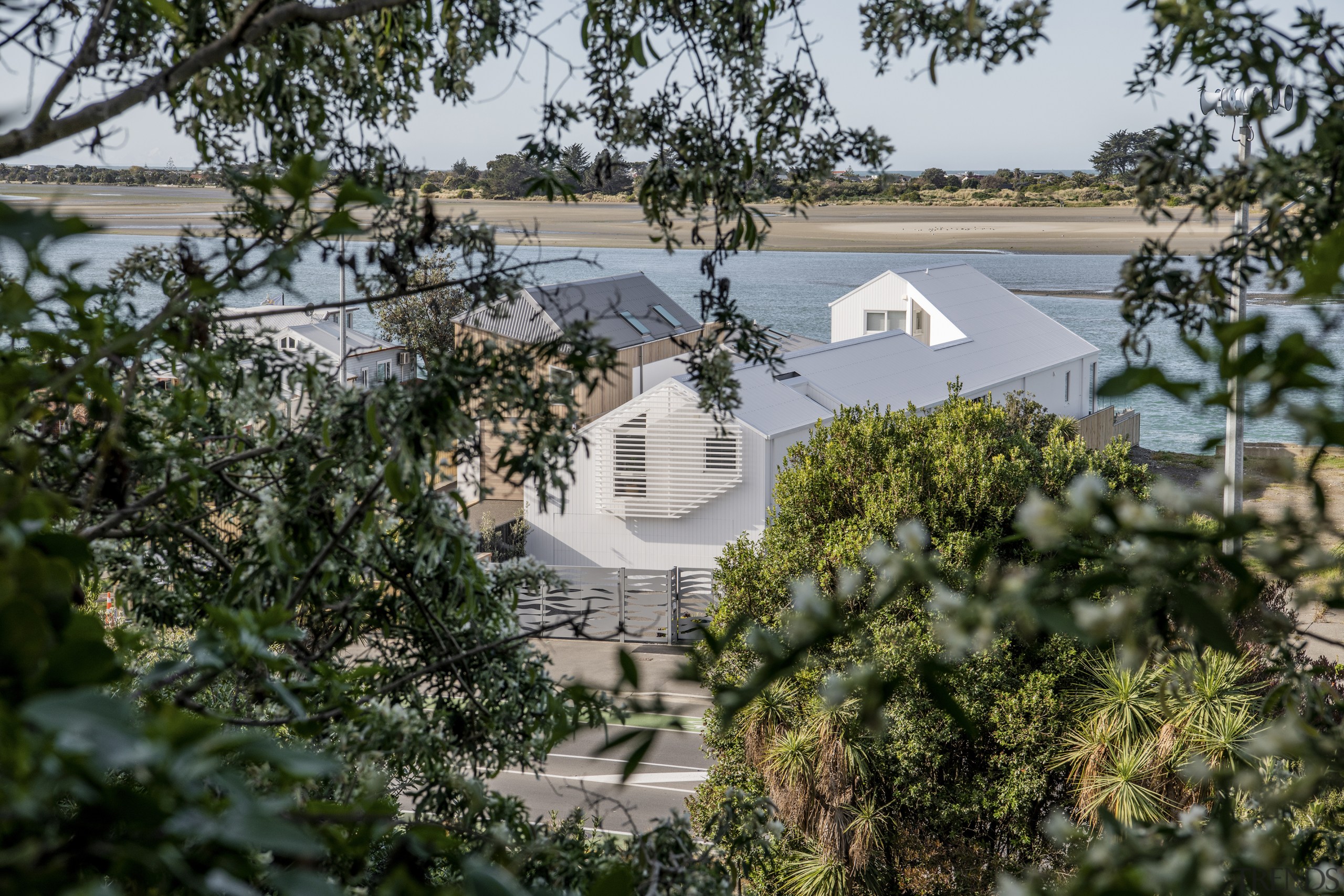 The home's gabled forms downplay its impact on 