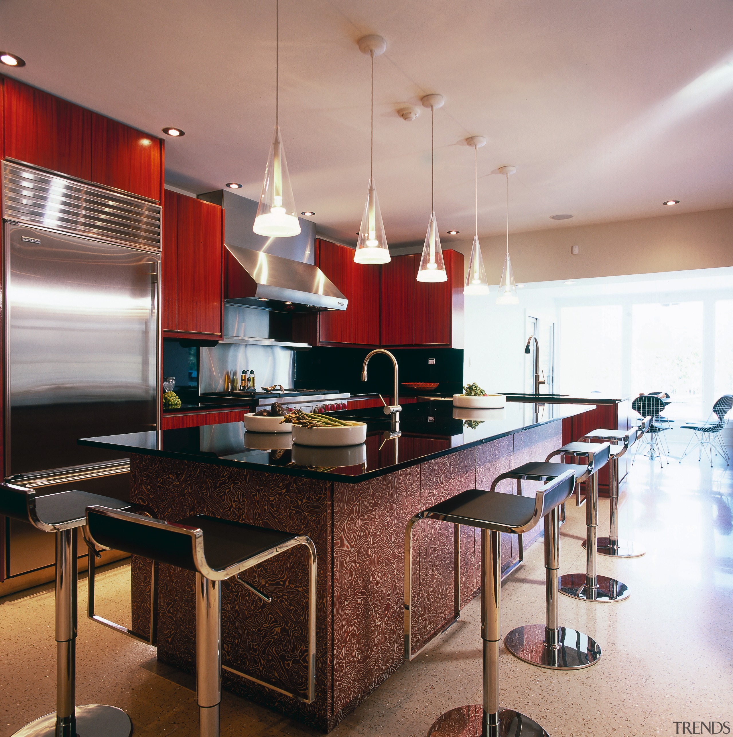 A view of this kitchen featuring terrazzo flooring, cabinetry, ceiling, countertop, interior design, kitchen, room, table, gray