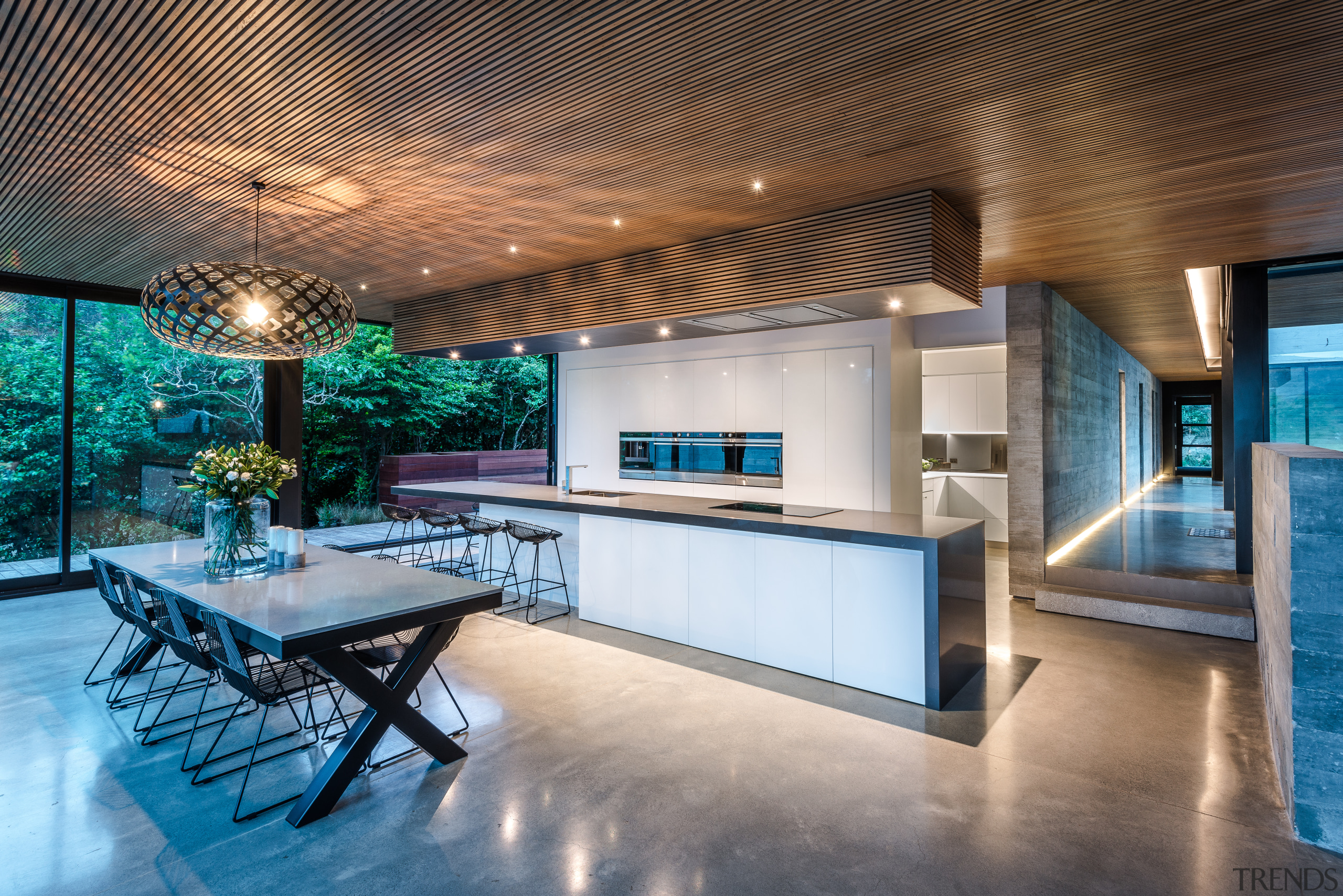 ​​​​​​​This kitchen is the hub of the home architecture, building, ceiling, countertop, design, estate, floor, flooring, furniture, home, house, interior design, kitchen, lighting, loft, property, real estate, room, table, gray