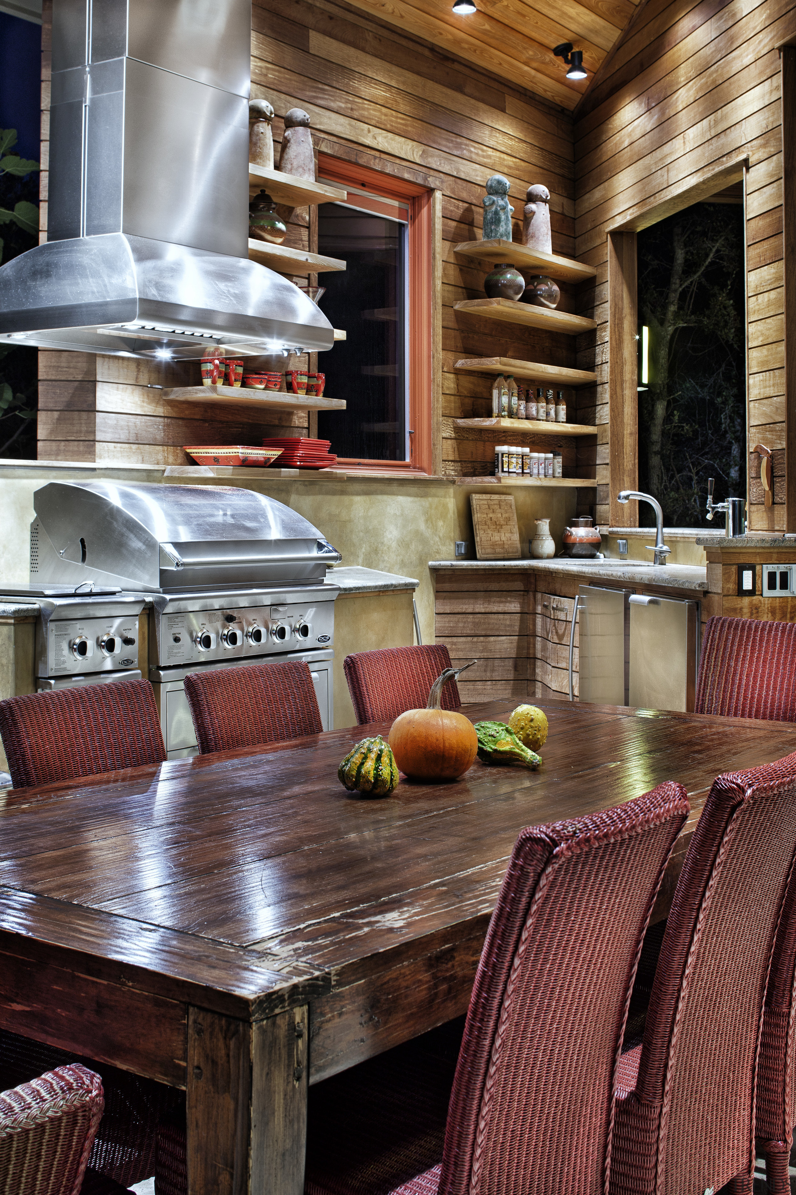 Rustic, weathered ipe siding lines the interior of countertop, dining room, furniture, home, interior design, kitchen, living room, table, wood, red