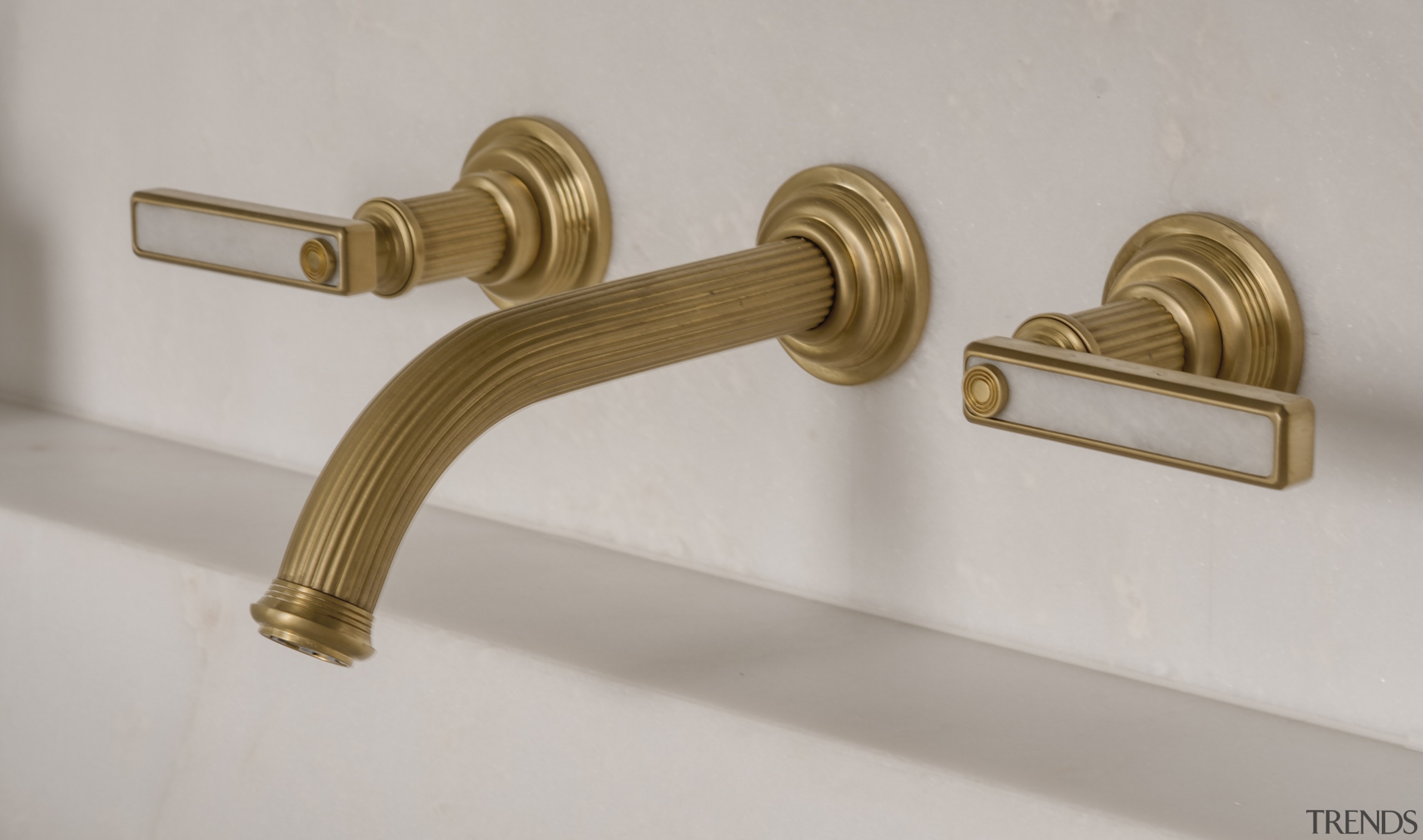 Bronze/gold tapware with inlayed handles offer an opulent 