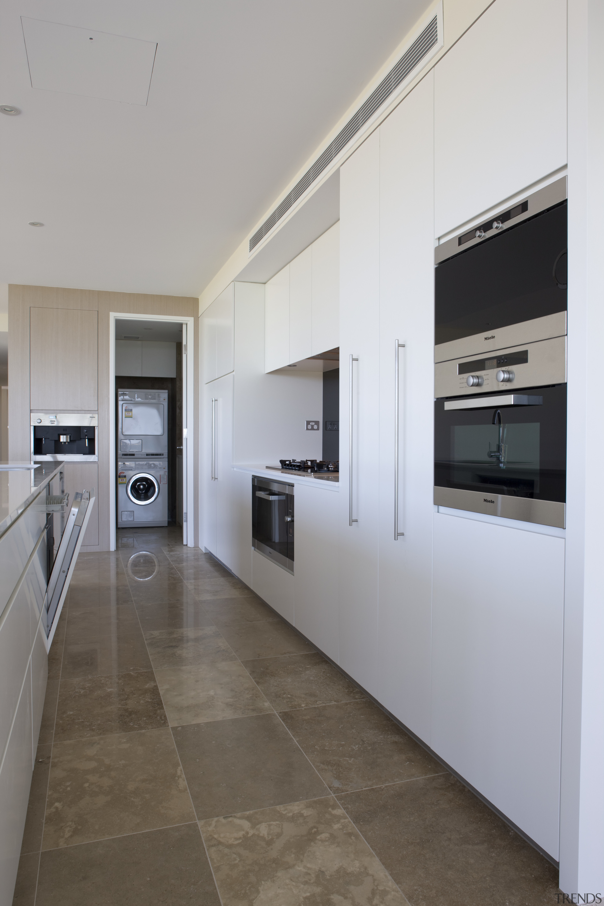 View of kitchen which features microwave combi oven, architecture, countertop, floor, interior design, kitchen, real estate, gray