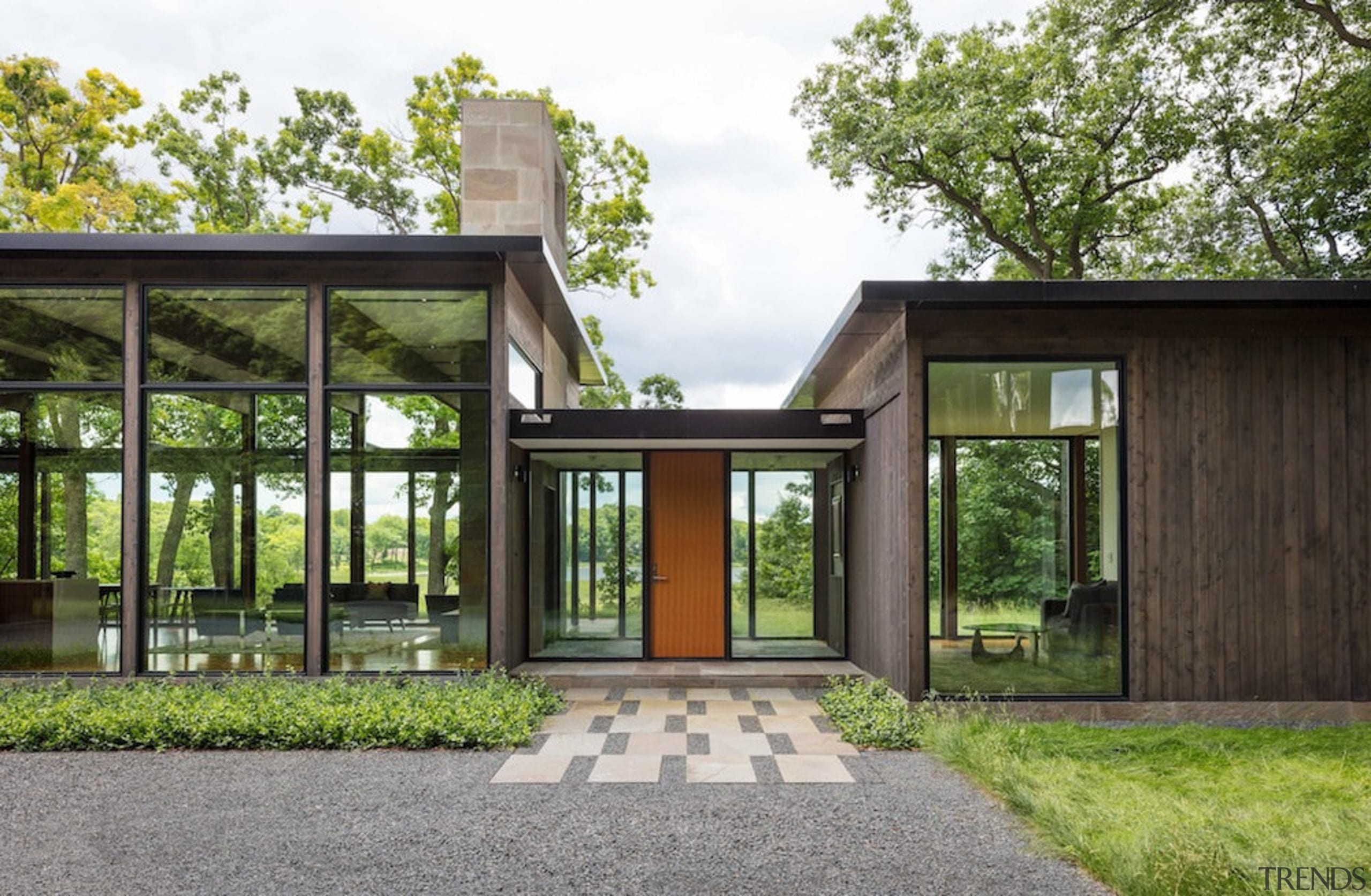 The entrance hall sits between two larger volumes architecture, estate, facade, home, house, property, real estate