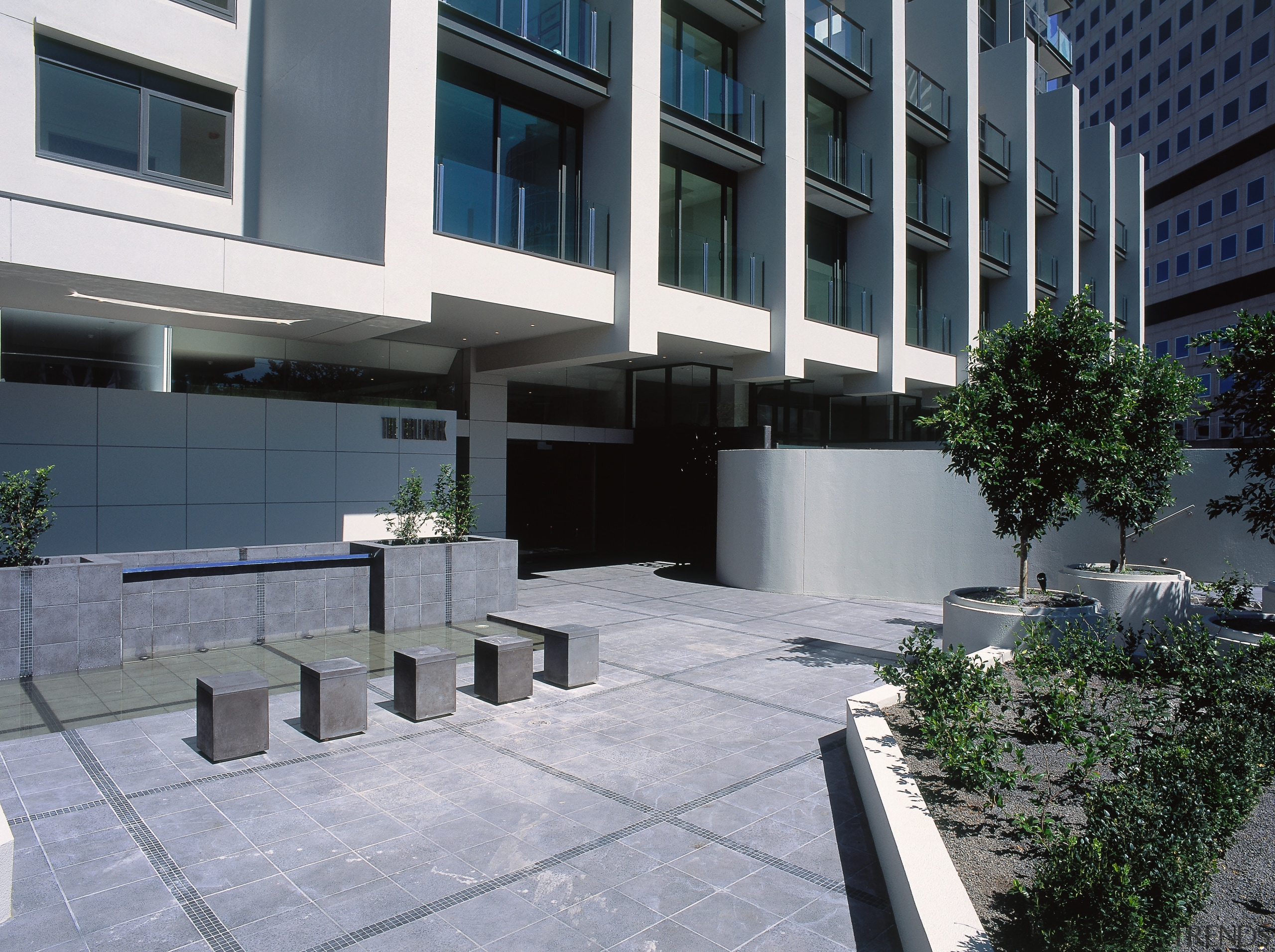 view of the outdoor area and entrance to apartment, architecture, building, condominium, corporate headquarters, courtyard, facade, house, mixed use, neighbourhood, property, real estate, residential area, walkway, gray, black