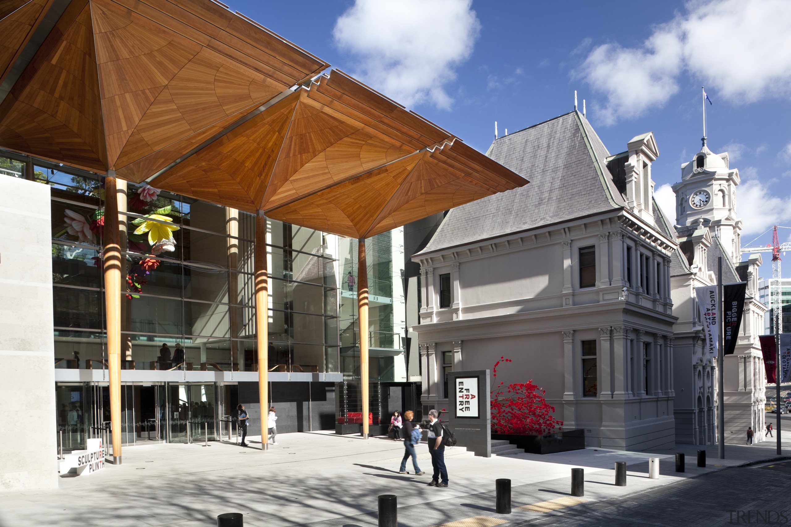 Here is a view of the Auckland Art building, facade, mixed use, town, white