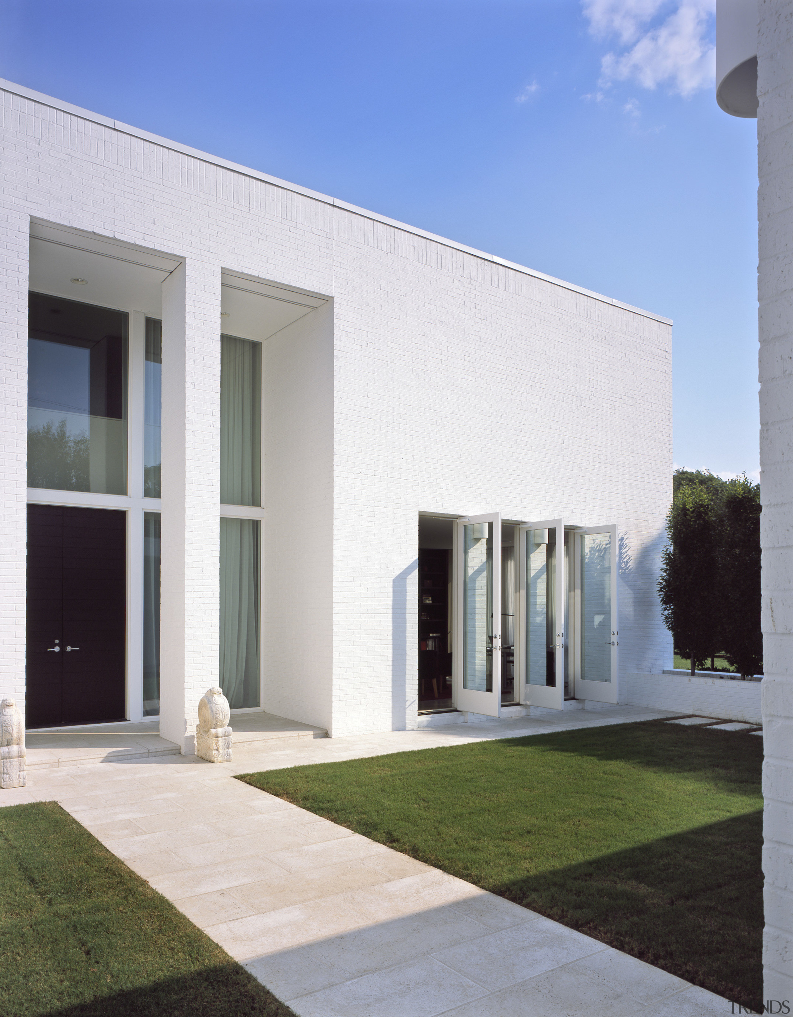 Exterior view of the grand entrance way - architecture, building, daytime, elevation, estate, facade, home, house, property, real estate, residential area, sky, villa, window, white