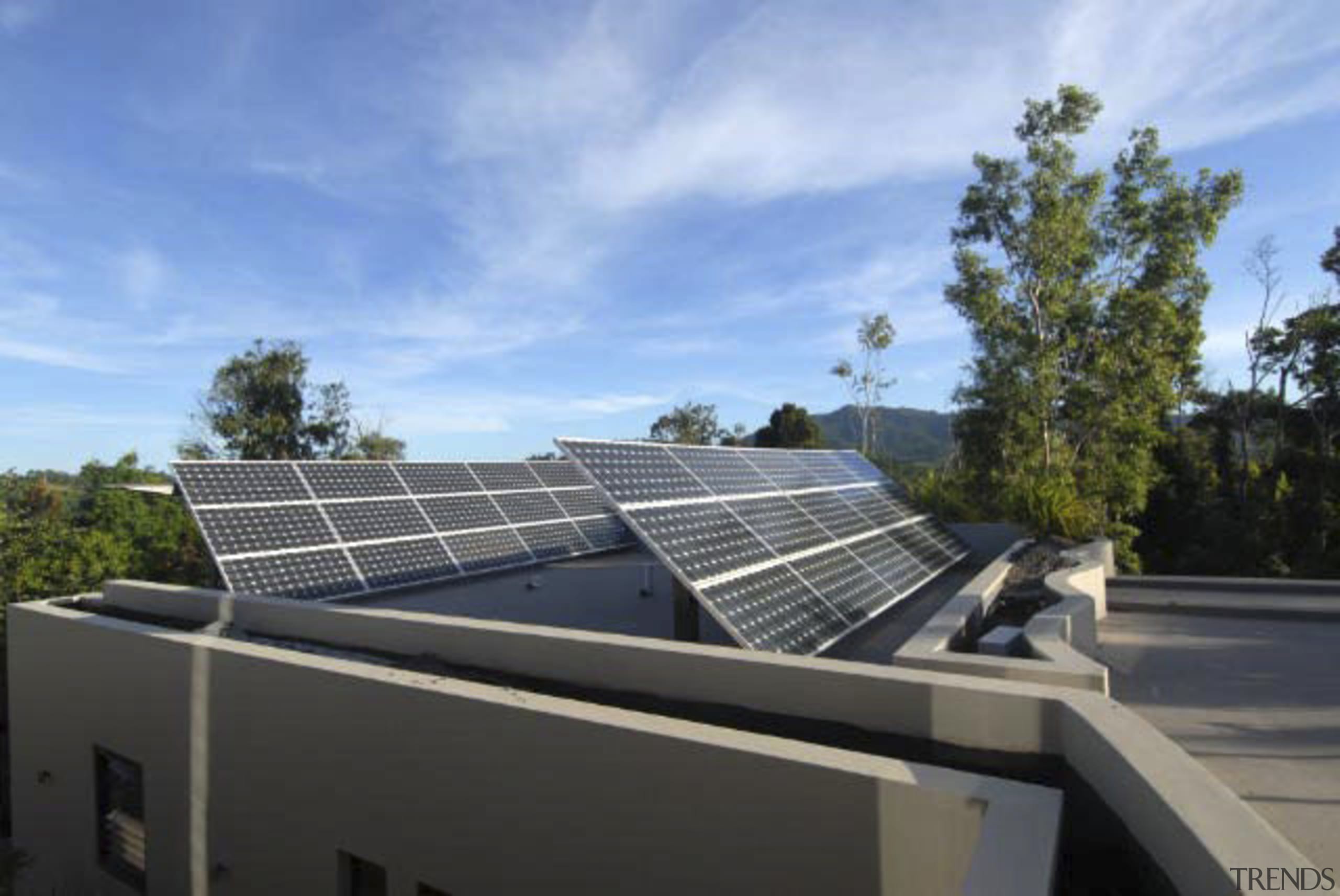 Exterior view of house which features solar panels. daylighting, energy, real estate, roof, solar energy, solar panel, solar power, technology, teal, black