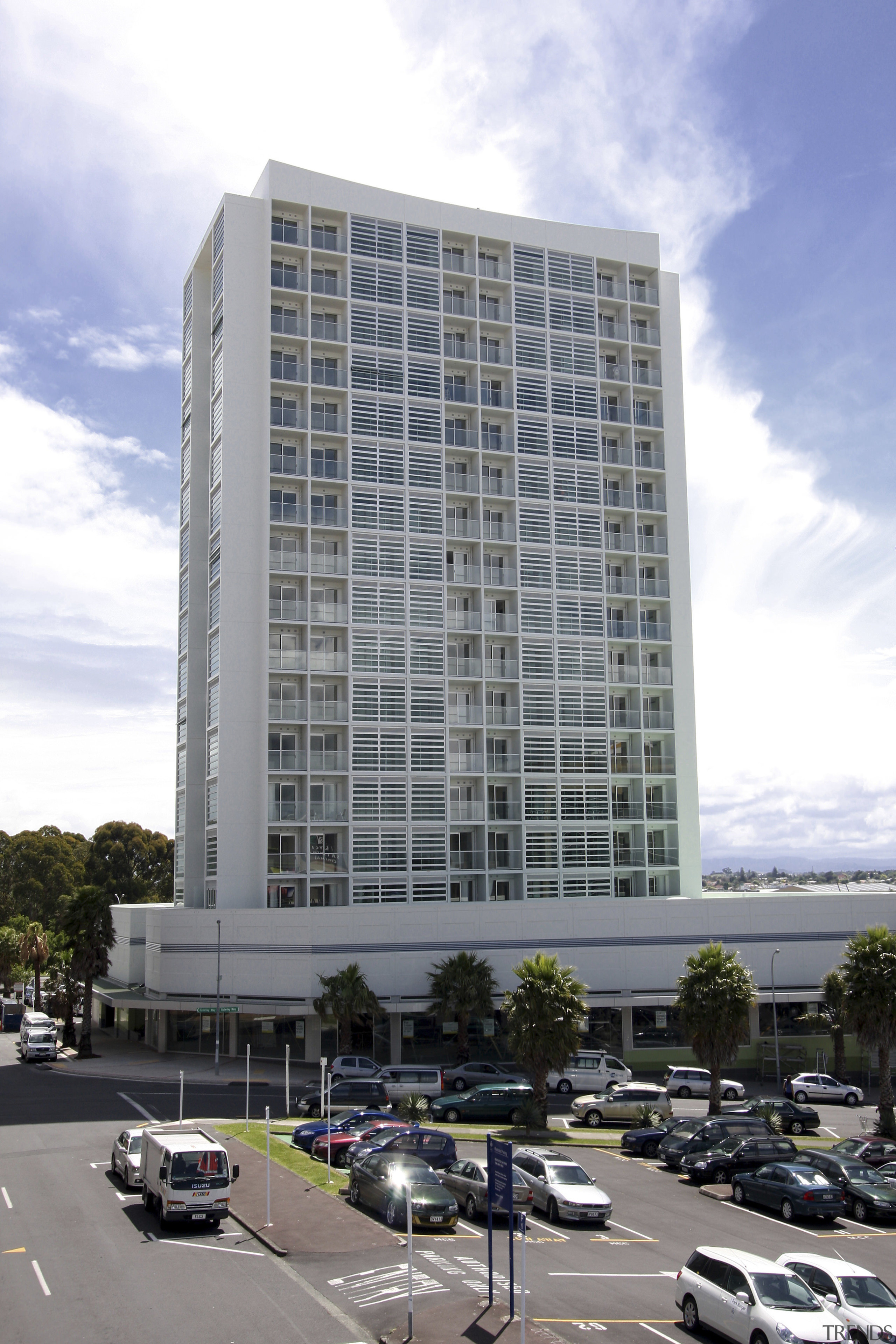 Exterior view of the entrance way of the apartment, architecture, building, city, commercial building, condominium, corporate headquarters, daytime, downtown, facade, headquarters, hotel, metropolis, metropolitan area, mixed use, neighbourhood, real estate, residential area, sky, skyscraper, tower block, urban area, gray, white