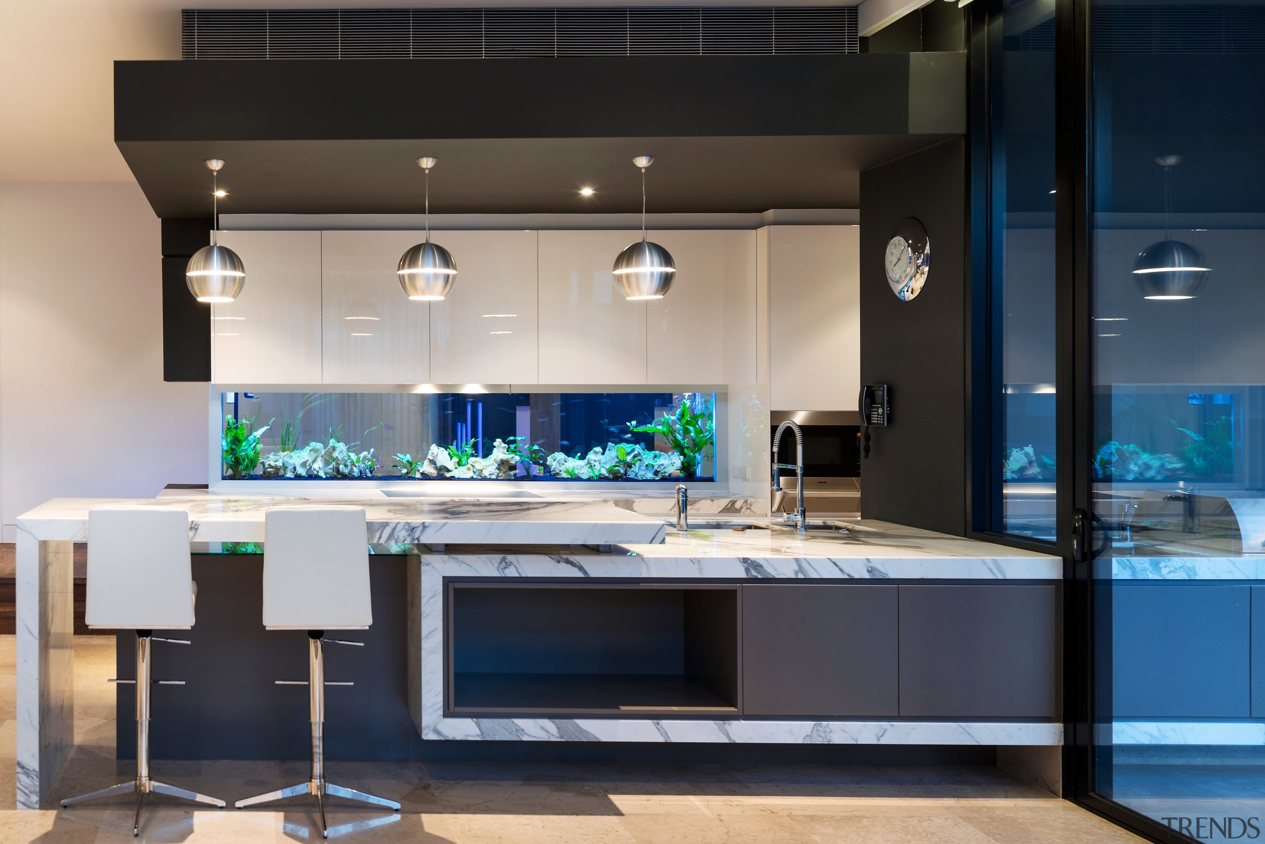 This award-winning kitchen by AG Constructions has a countertop, home appliance, interior design, kitchen, black, gray