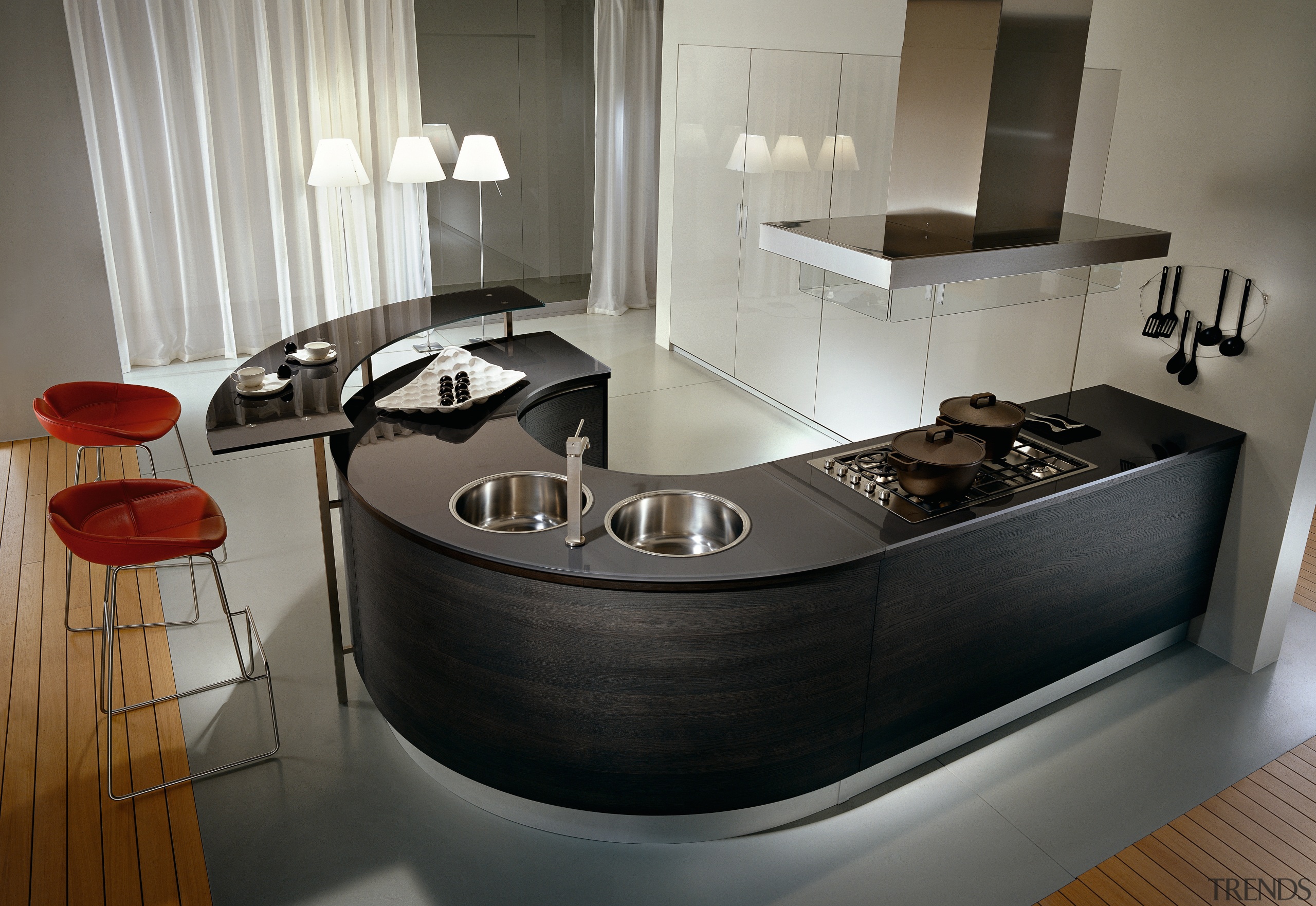 A view of a Pedini kitchen, with curved countertop, furniture, interior design, kitchen, product design, gray, black