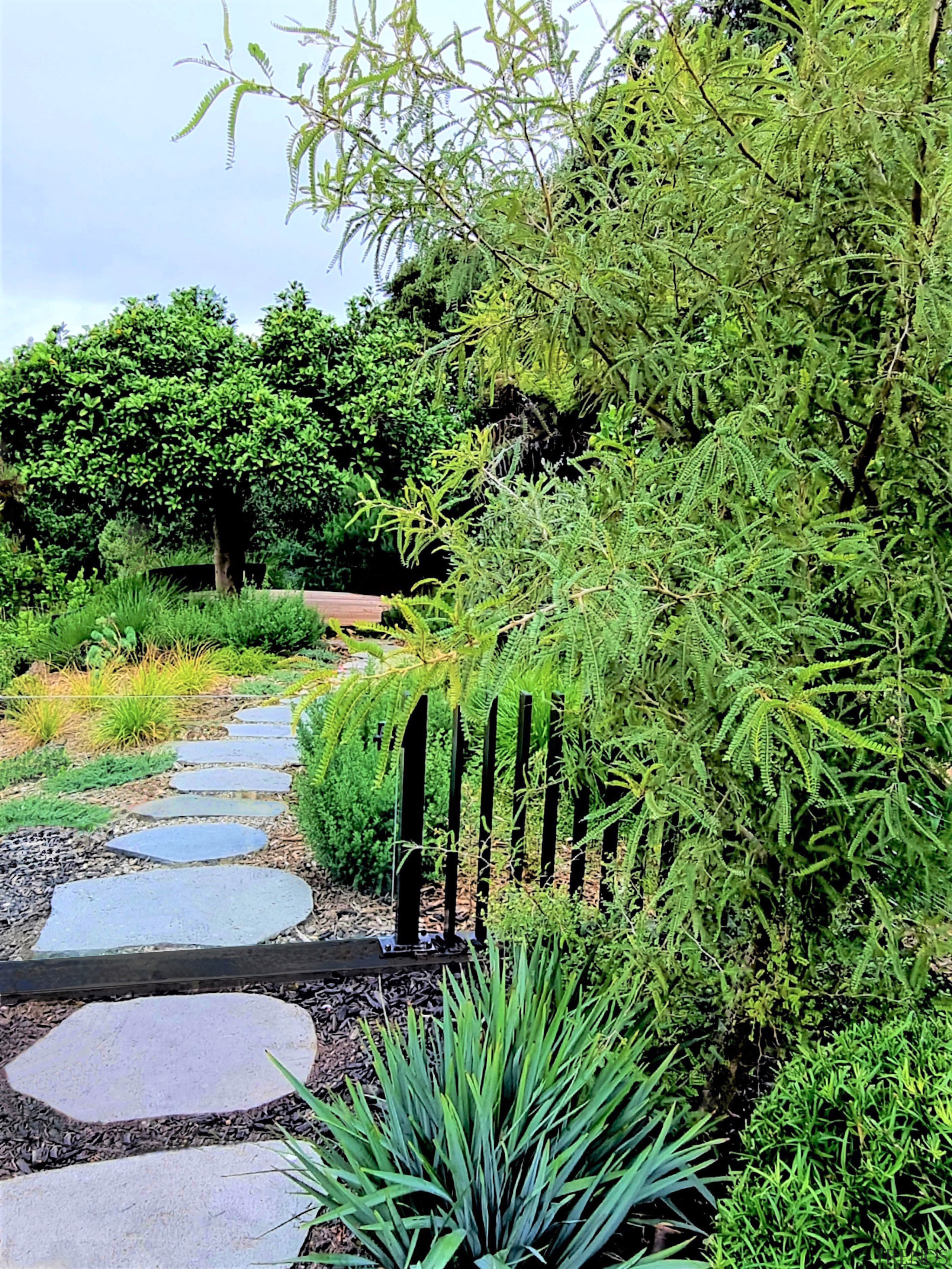 Down the garden path. A glass gate allows 