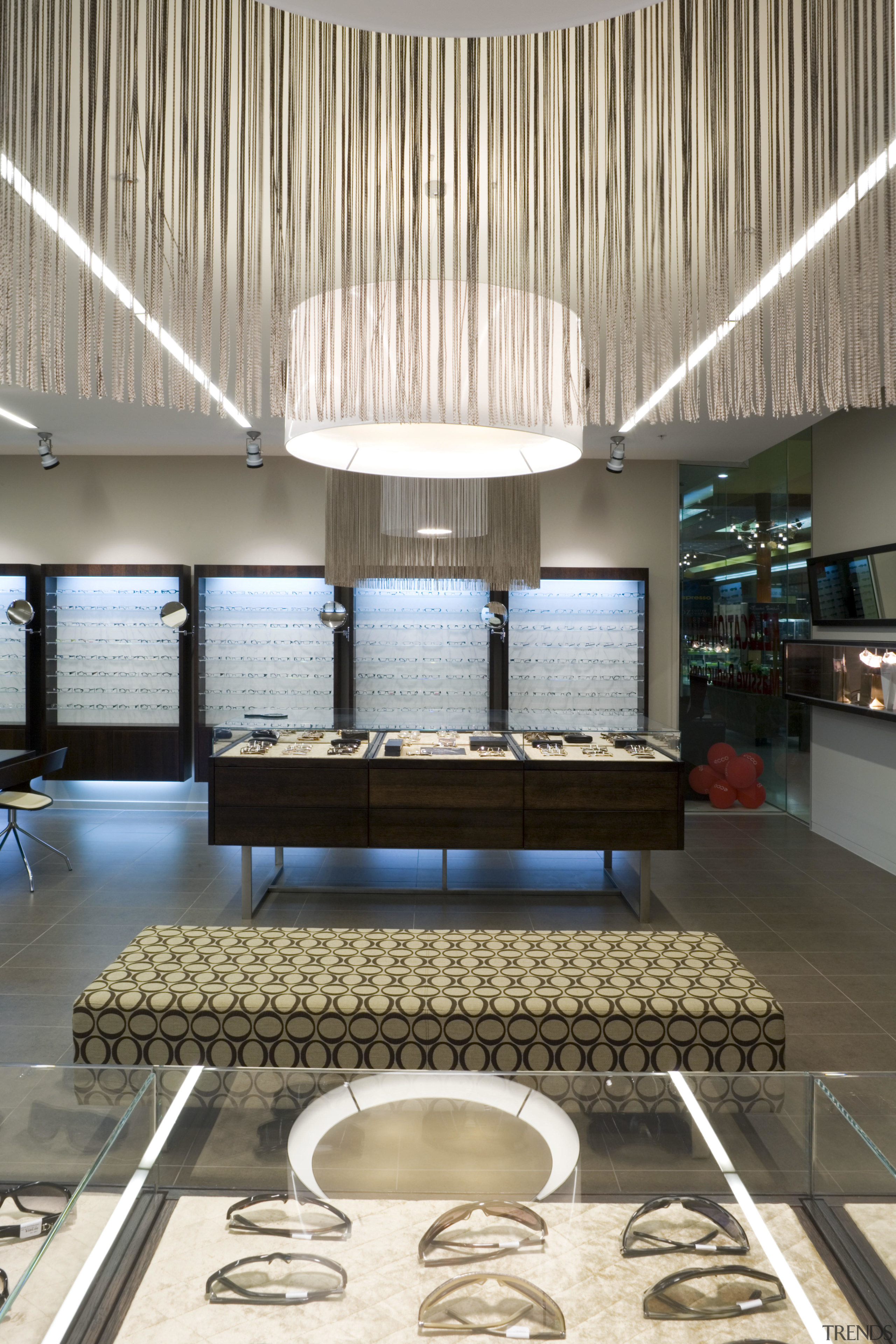 Image of Eyewear shop featuring cladding, cabinetry, tiled architecture, ceiling, daylighting, interior design, lobby, white