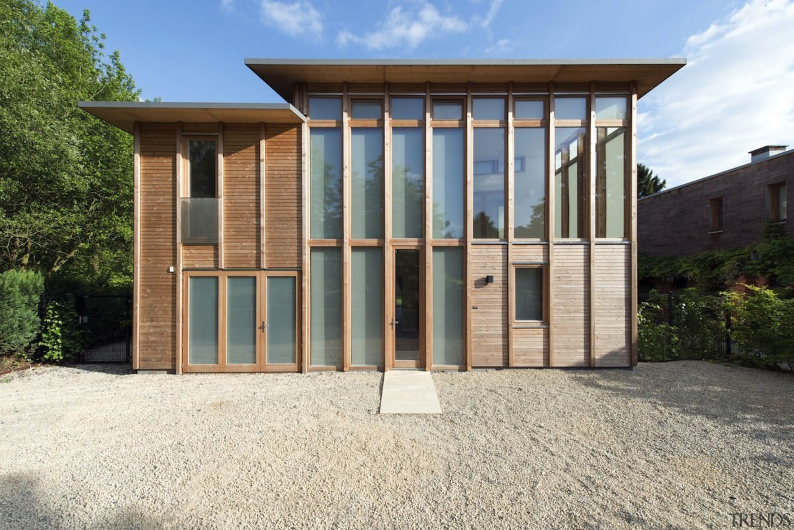 Glass runs from the ground floor up to architecture, facade, home, house, property, real estate, shed, white