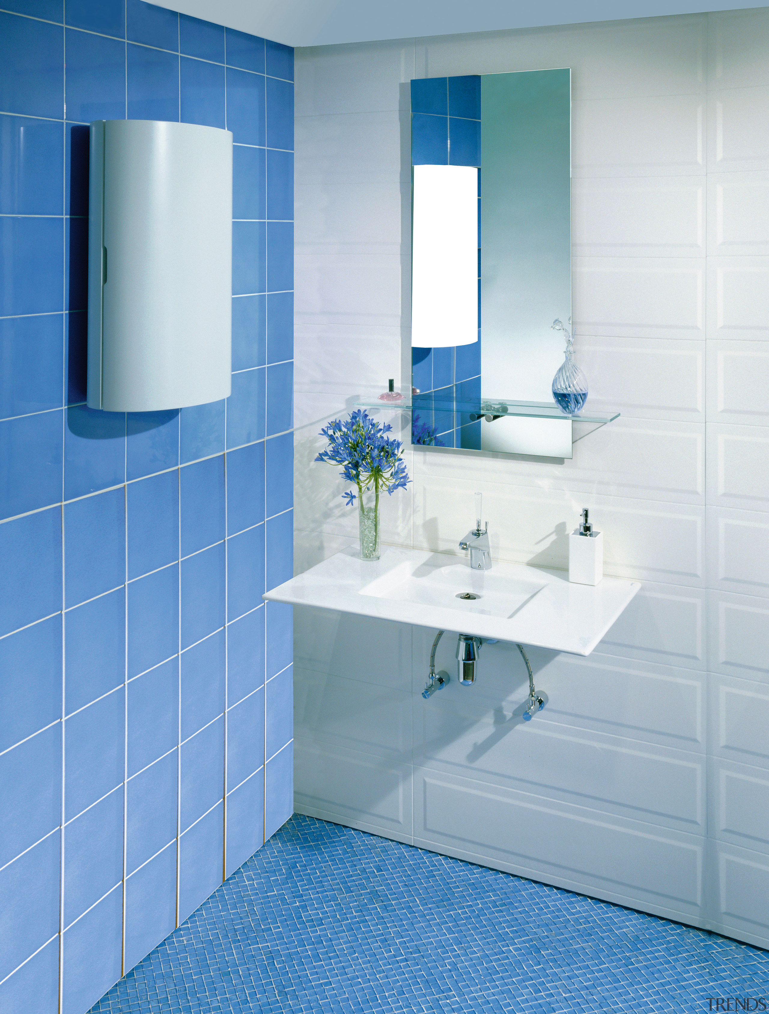 view of this bathroom featuring blue wall tiles, azure, bathroom, bathroom accessory, bathroom cabinet, bathroom sink, blue, floor, flooring, interior design, plumbing fixture, product design, purple, room, sink, tap, tile, wall, teal, gray