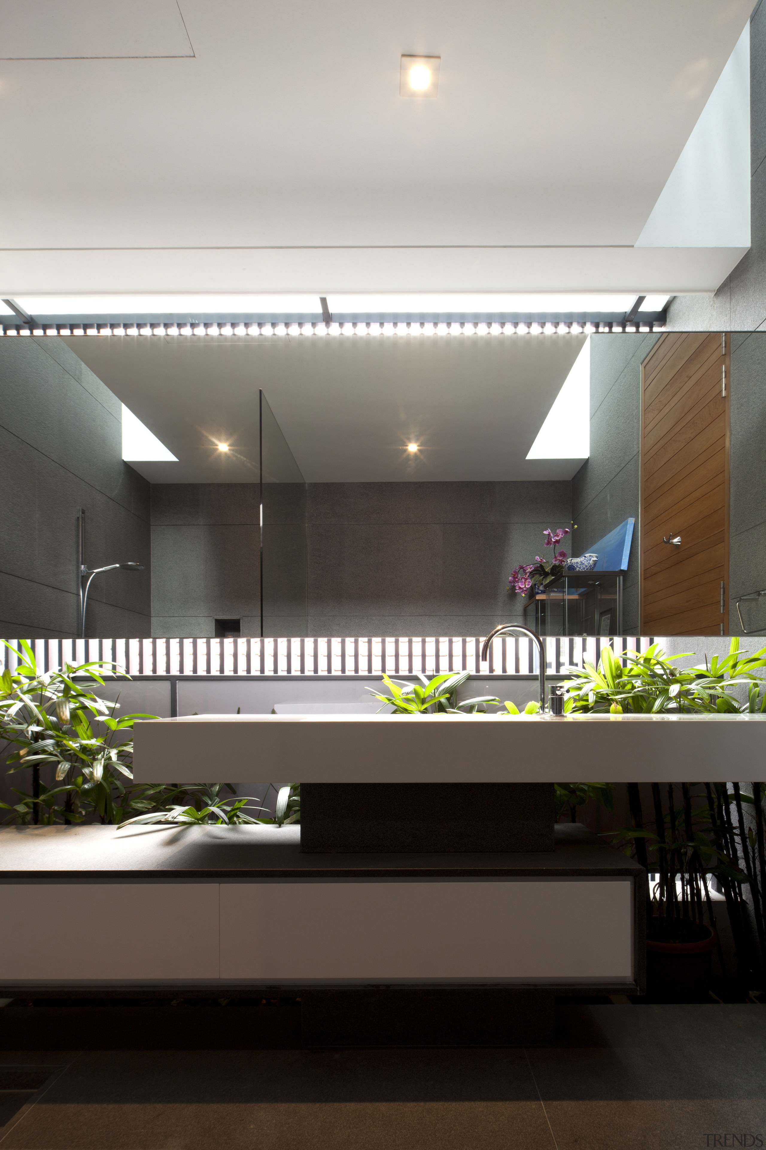 The guest bathroom in this tropical family home architecture, ceiling, daylighting, house, interior design, lobby, gray, black