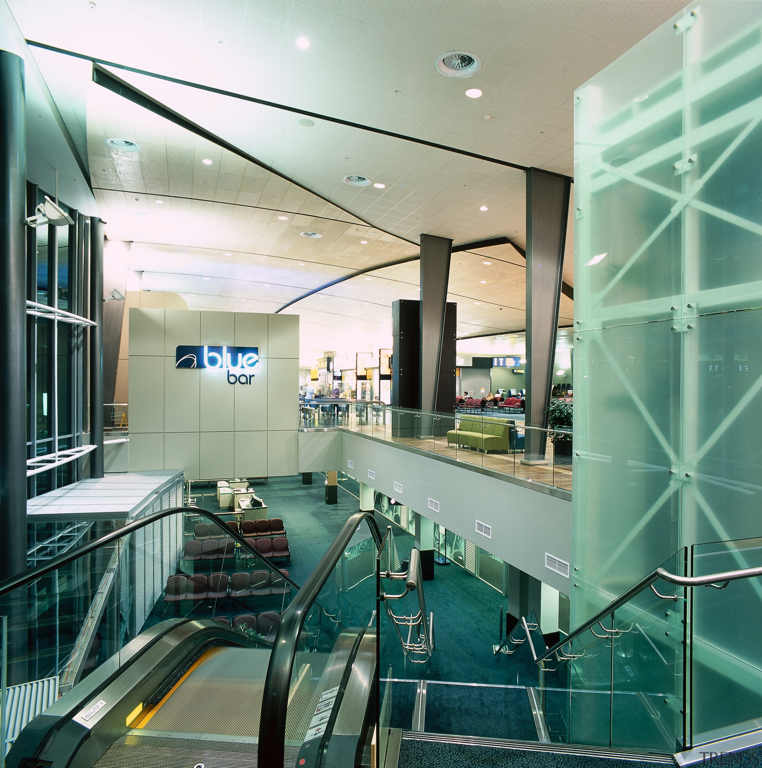 Escalator and stairs leading down to lower level ceiling, condominium, glass, interior design, leisure centre, lobby, green