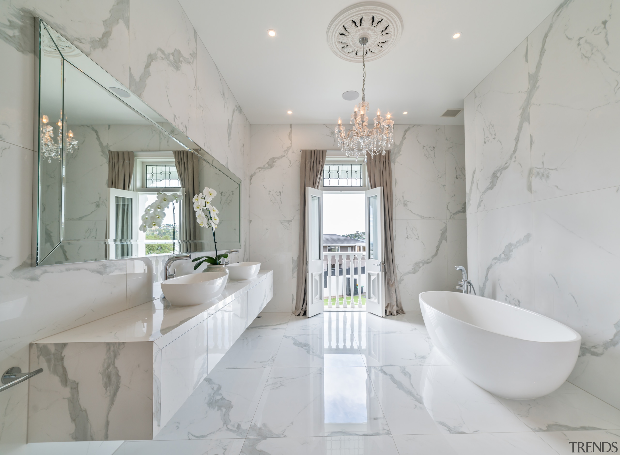 The main, marble-look bathroom exudes a five star 