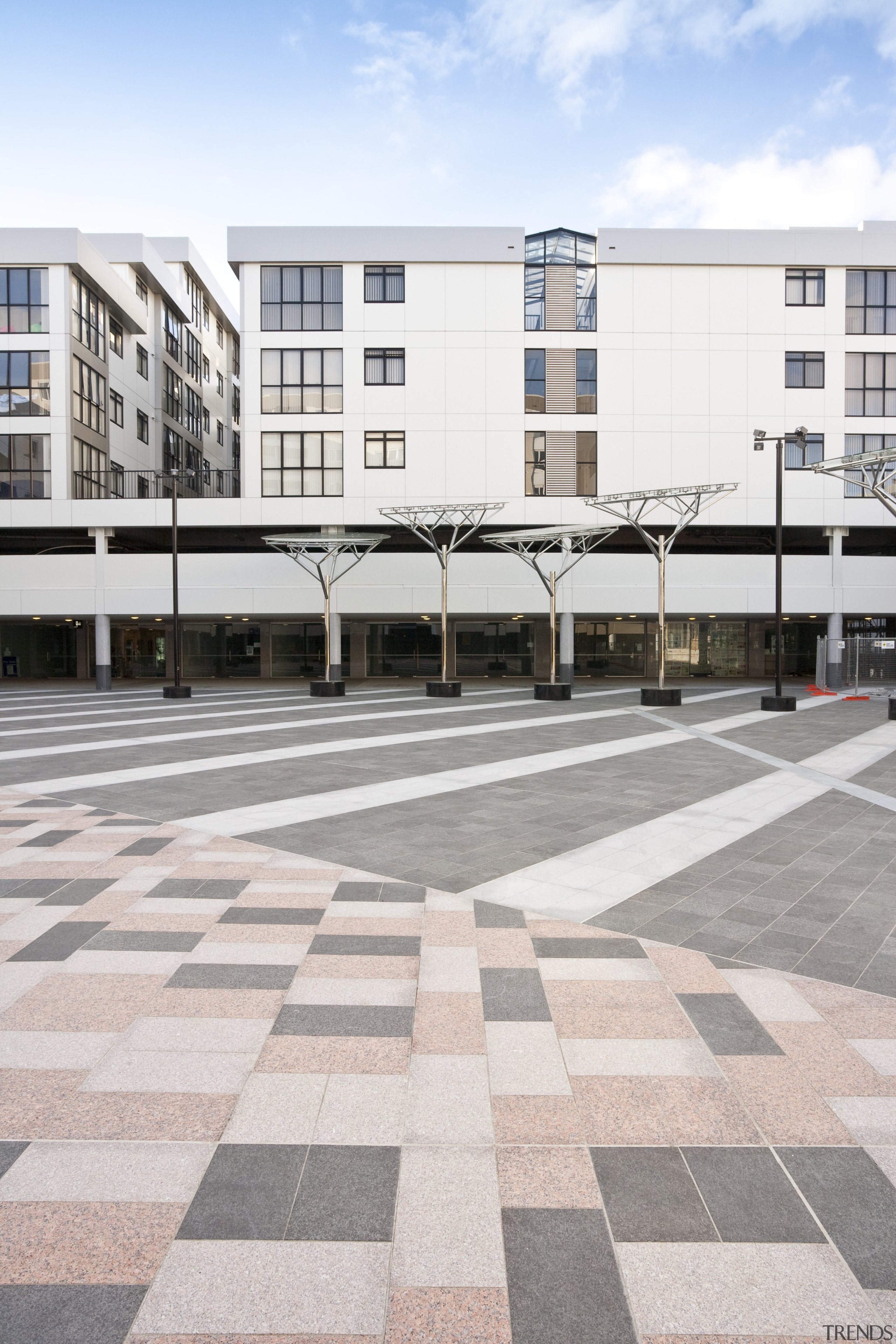 External view of Kings square/Queens lodge development. Tiling architecture, building, city, condominium, daytime, facade, line, public space, residential area, road surface, structure, urban area, urban design, white