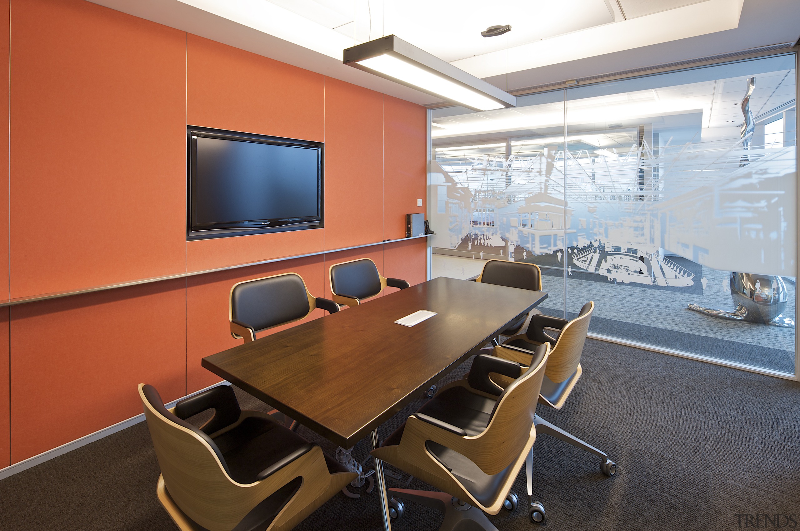 Interior view of a meeting room which features conference hall, furniture, interior design, office, table, red
