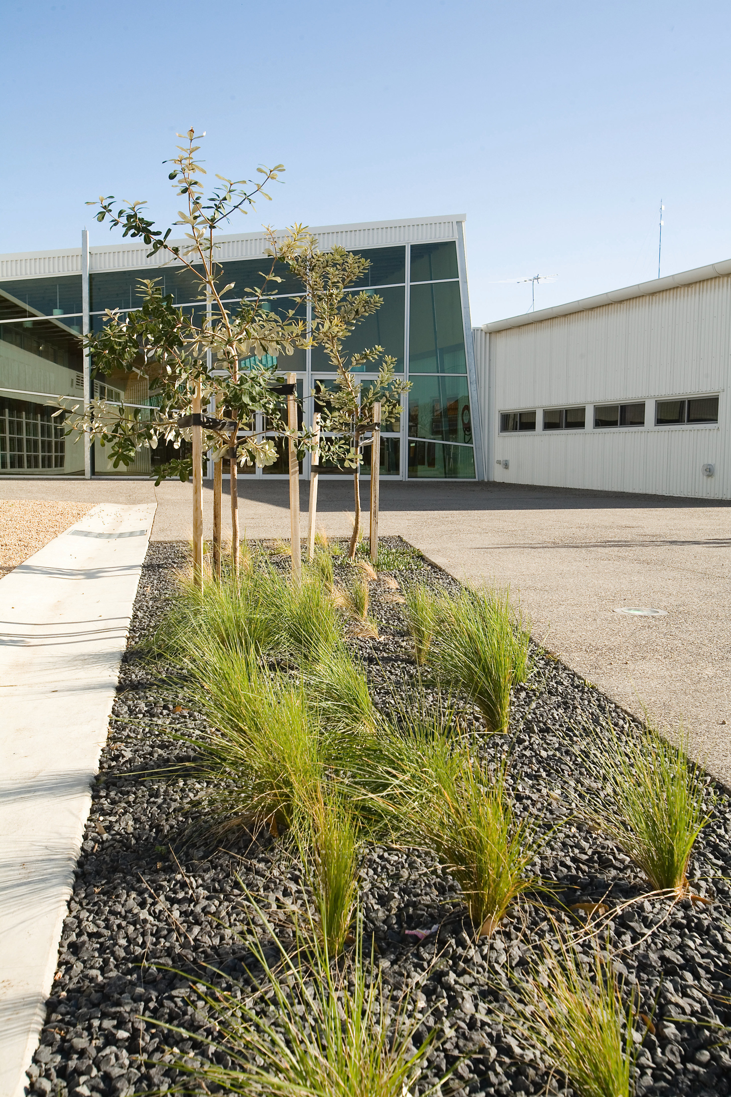 View of Williamstown High School in Melbourne. Designed architecture, grass, home, house, landscaping, plant, real estate, residential area, tree, walkway