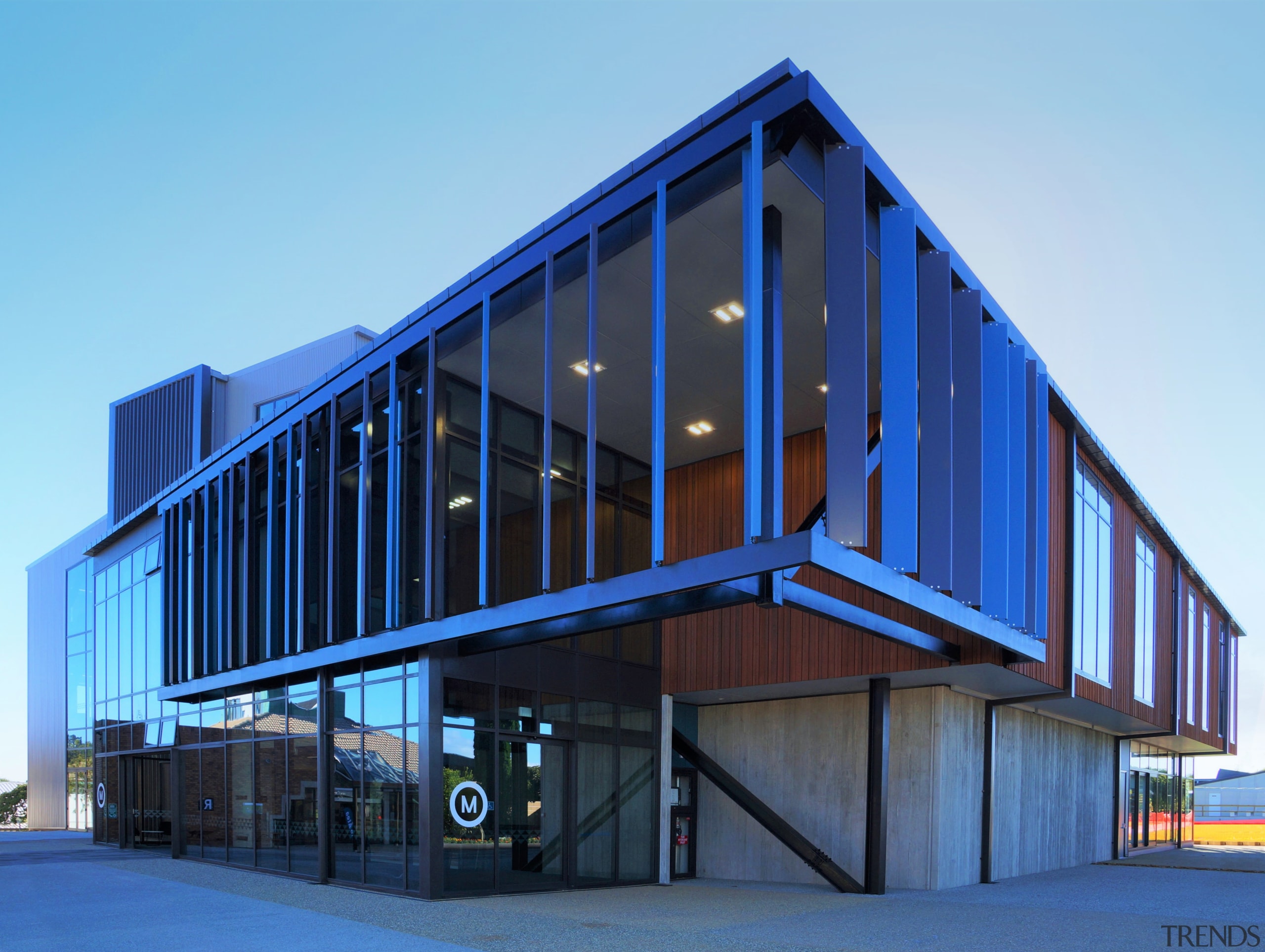 Metal louvres signal the entrance to Te Ara architecture, building, commercial building, corporate headquarters, facade, headquarters, home, house, mixed use, real estate, residential area, sky, structure, window, teal, blue
