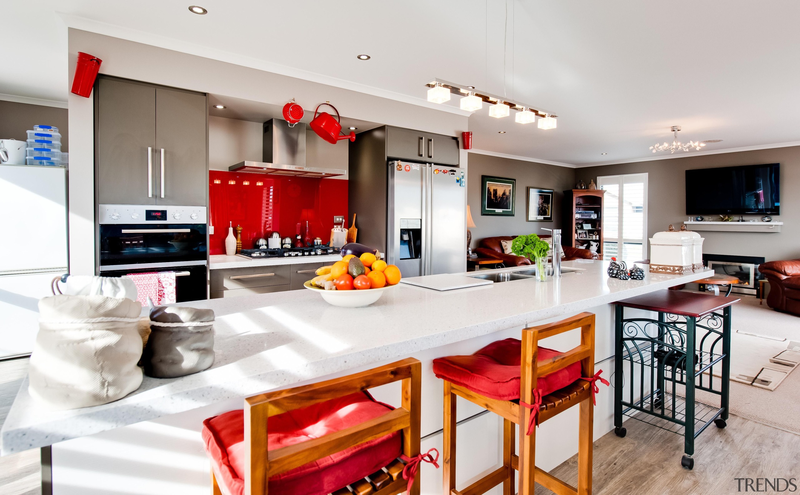 Island kitchen featured in a home built by countertop, interior design, kitchen, real estate, white