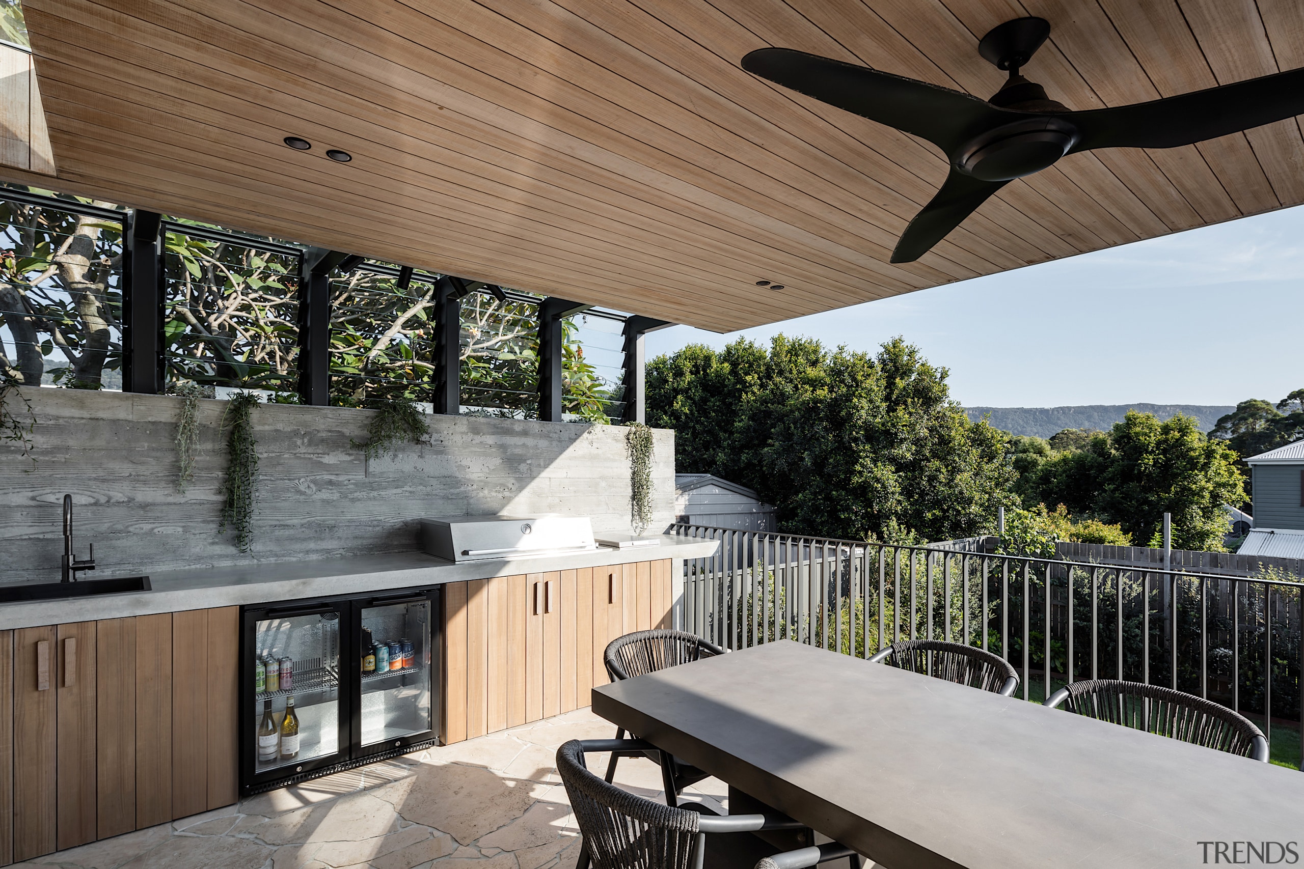 Rear sheltered outdoor living complete with barbecue and 