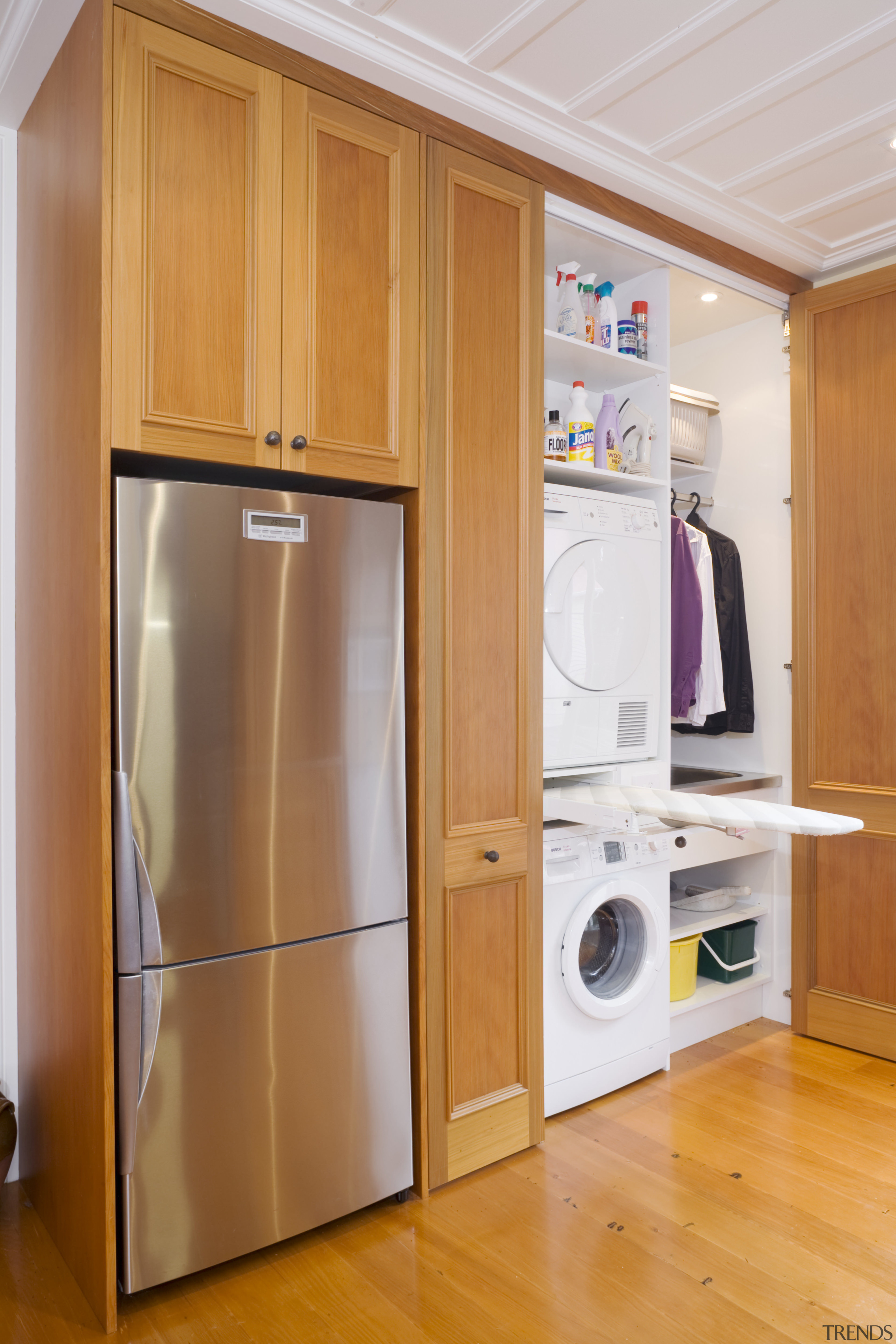 view of a renovated kitchen where Swamp kauri cabinetry, cupboard, furniture, home appliance, kitchen, major appliance, product, refrigerator, room, orange