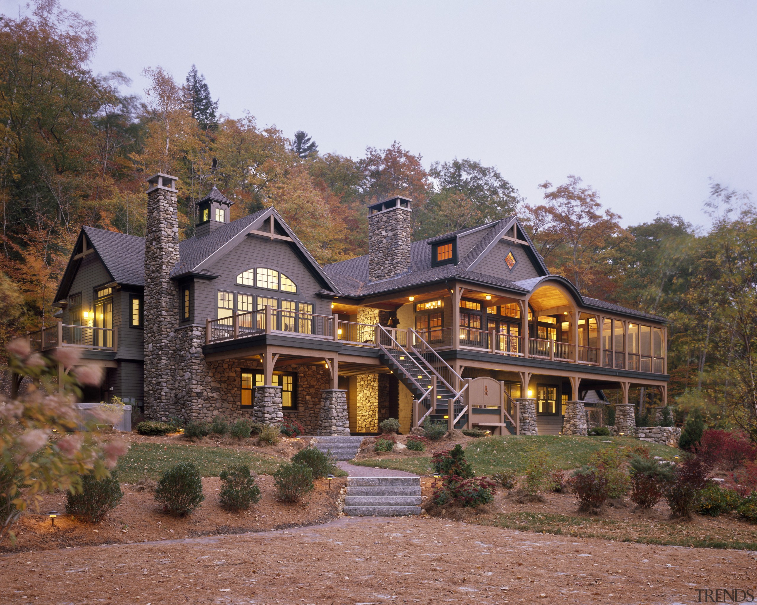 View of the holiday homes exterior featuring white cottage, estate, facade, farmhouse, home, house, mansion, property, real estate, tree, brown, white