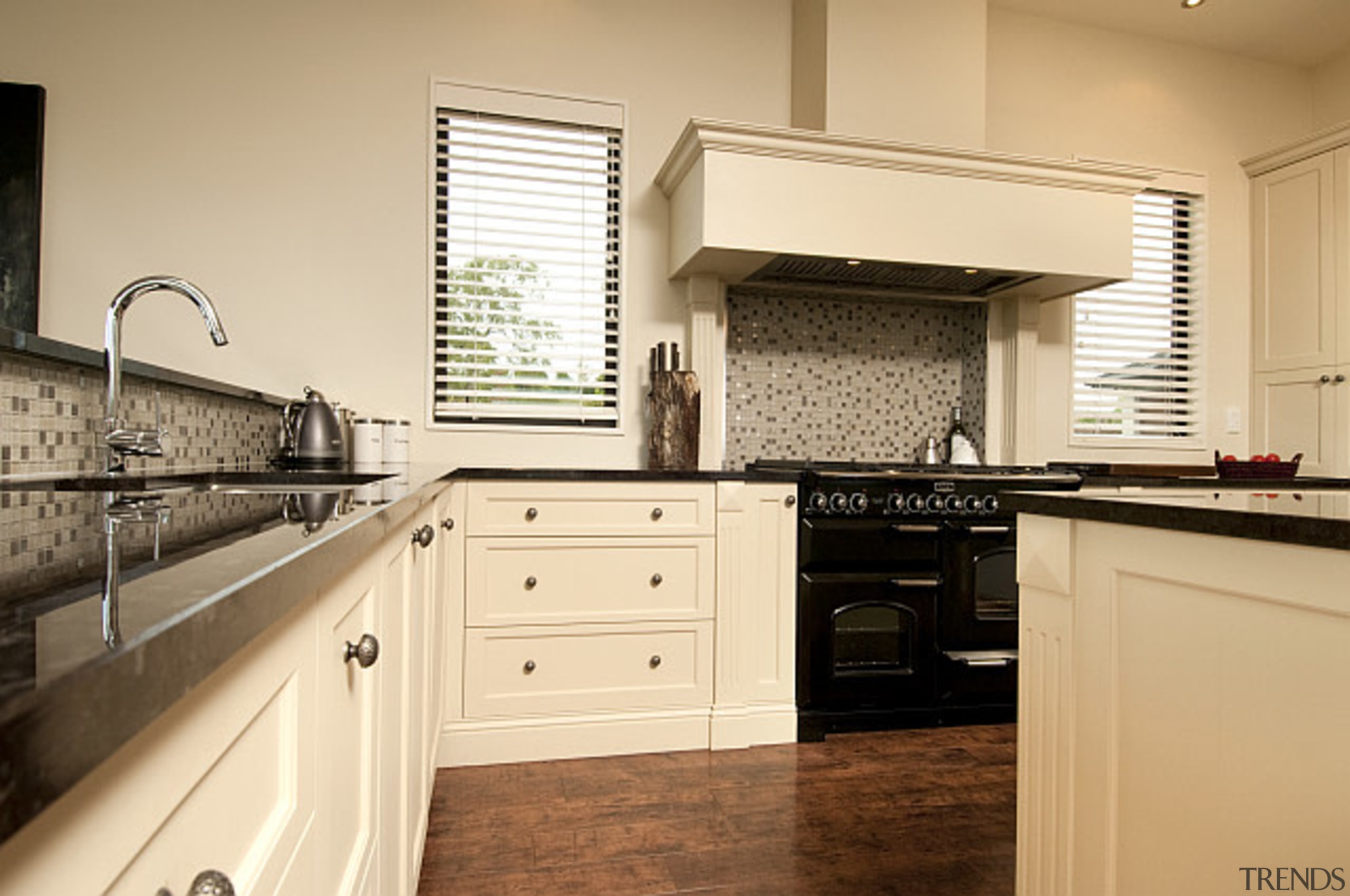 Traditional country style kitchen in this home by cabinetry, countertop, cuisine classique, floor, flooring, home, interior design, kitchen, real estate, room, orange, brown