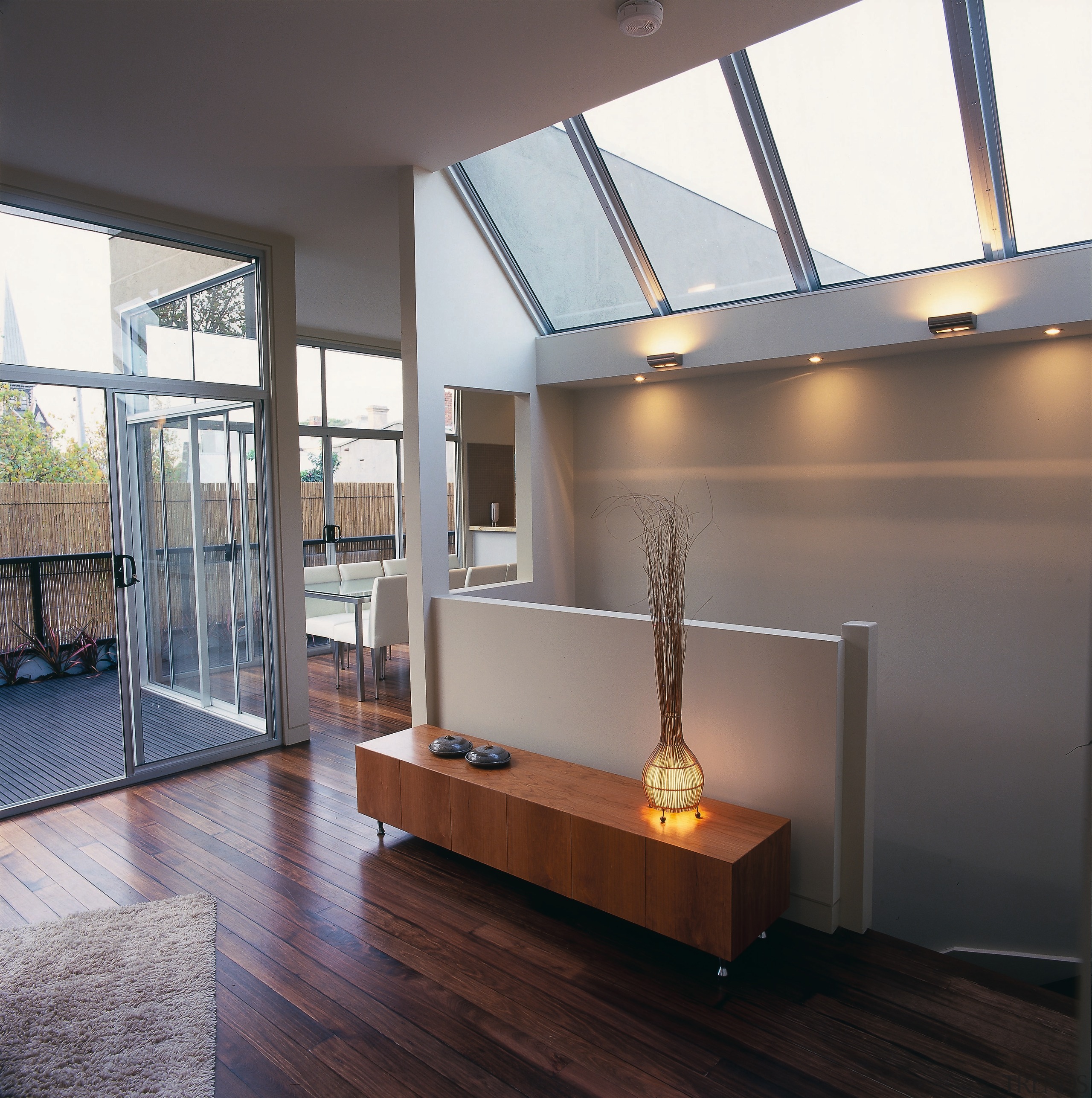 The view from the lounge overlooking a stairwell architecture, ceiling, daylighting, floor, flooring, hardwood, house, interior design, living room, loft, window, wood, wood flooring, gray, black