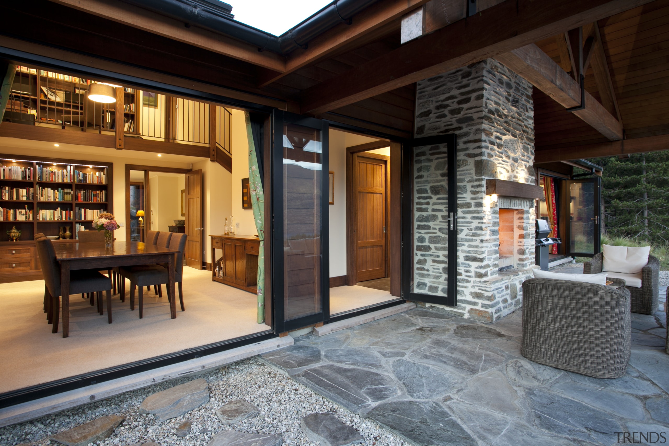 View of patio with stone flooring and chimney, estate, interior design, lobby, real estate, black, gray