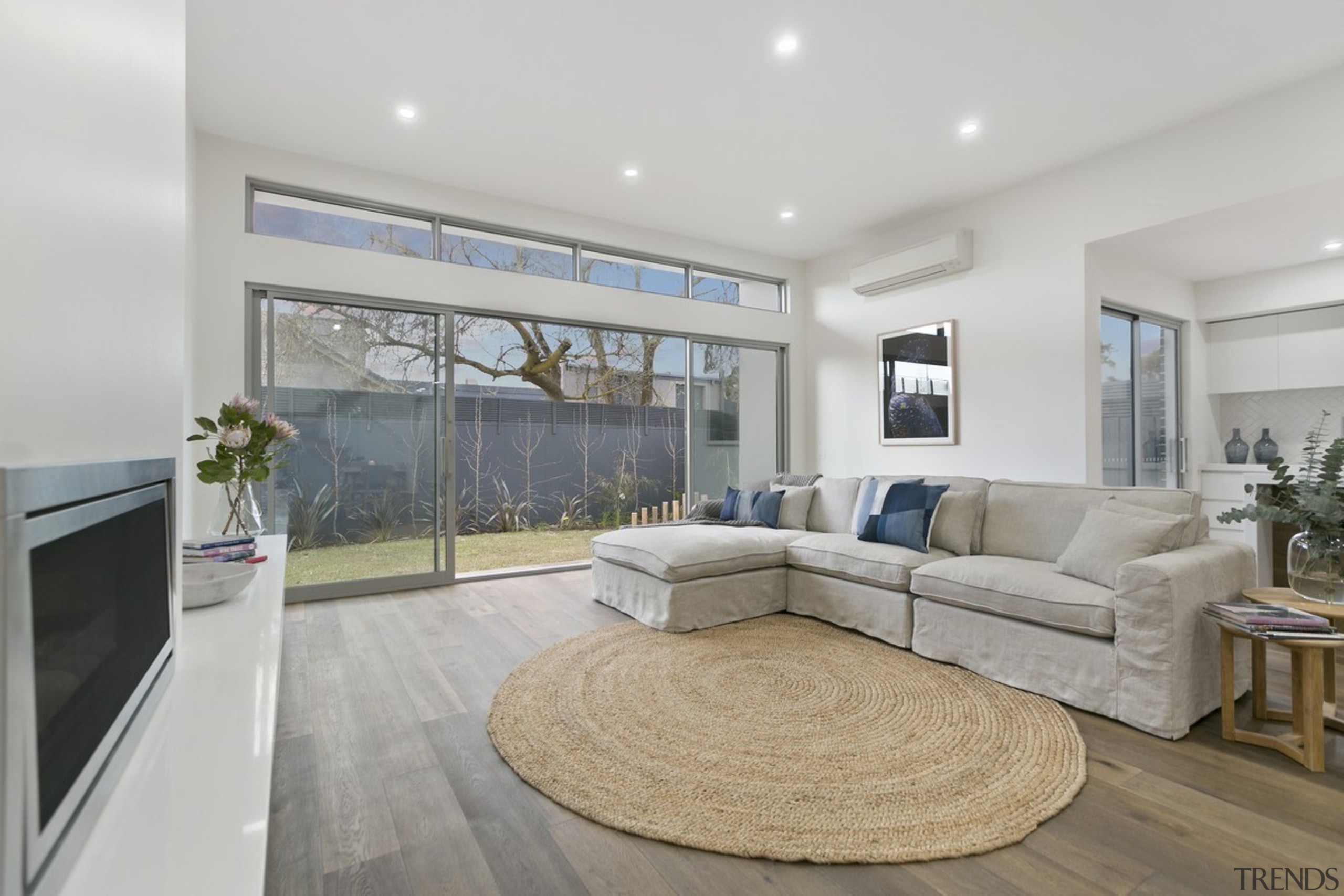 Looking out through the living room into the estate, floor, interior design, living room, property, real estate, window, gray