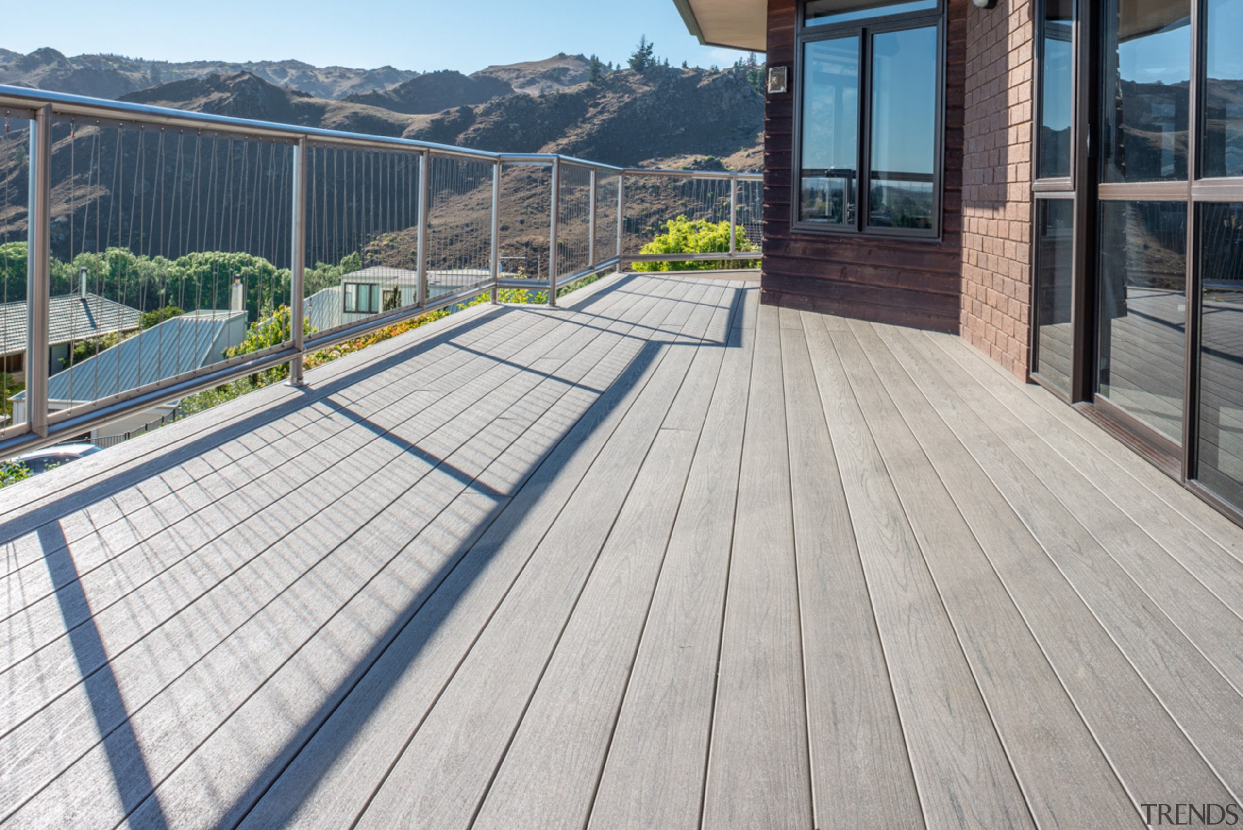 Central Otago Home Features A Beautiful TimberTech Composite composite material, deck, floor, handrail, outdoor structure, real estate, walkway, wood, gray