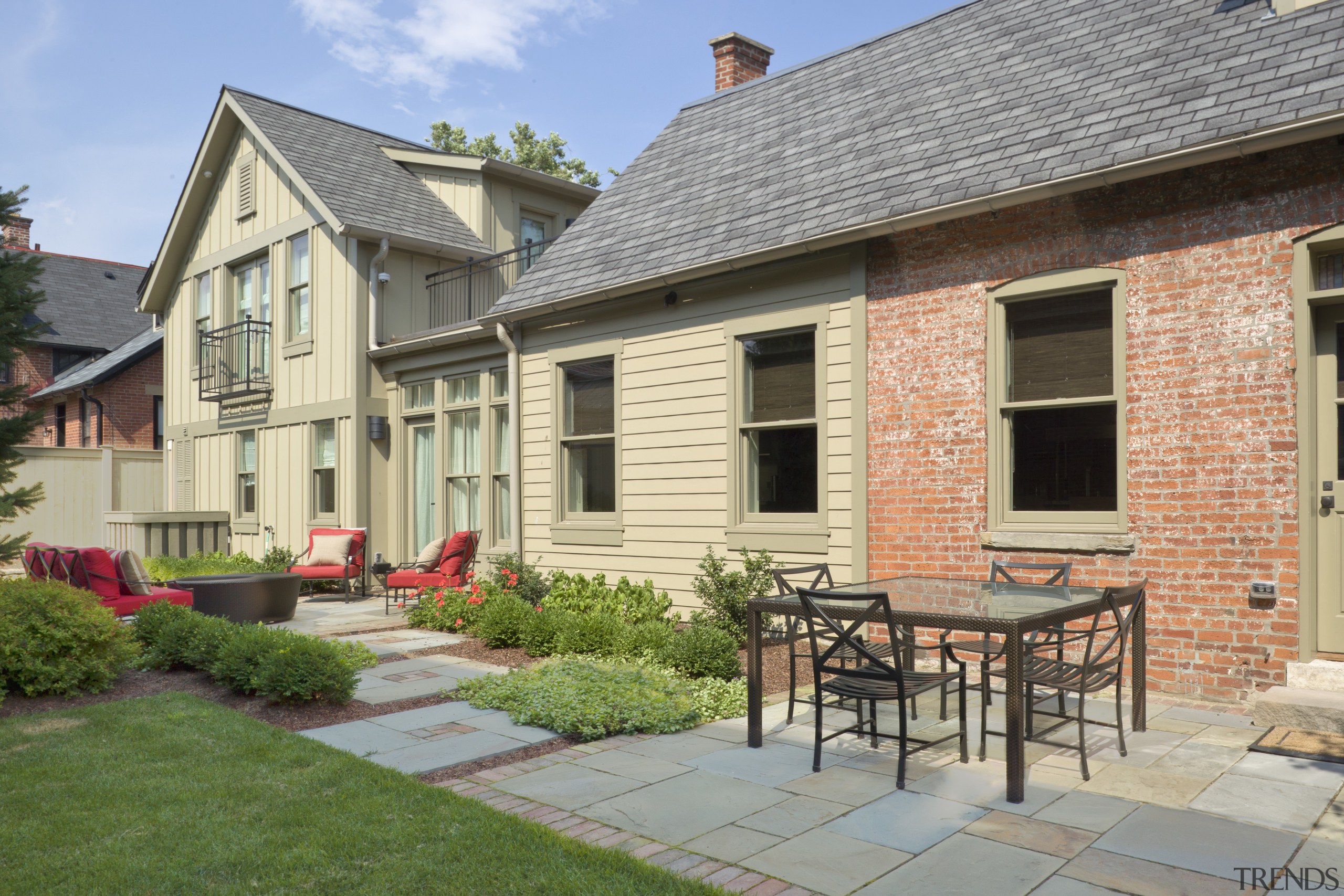 This is a home designed by John Behal backyard, cottage, courtyard, estate, facade, farmhouse, home, house, property, real estate, residential area, siding, window, yard, gray, orange