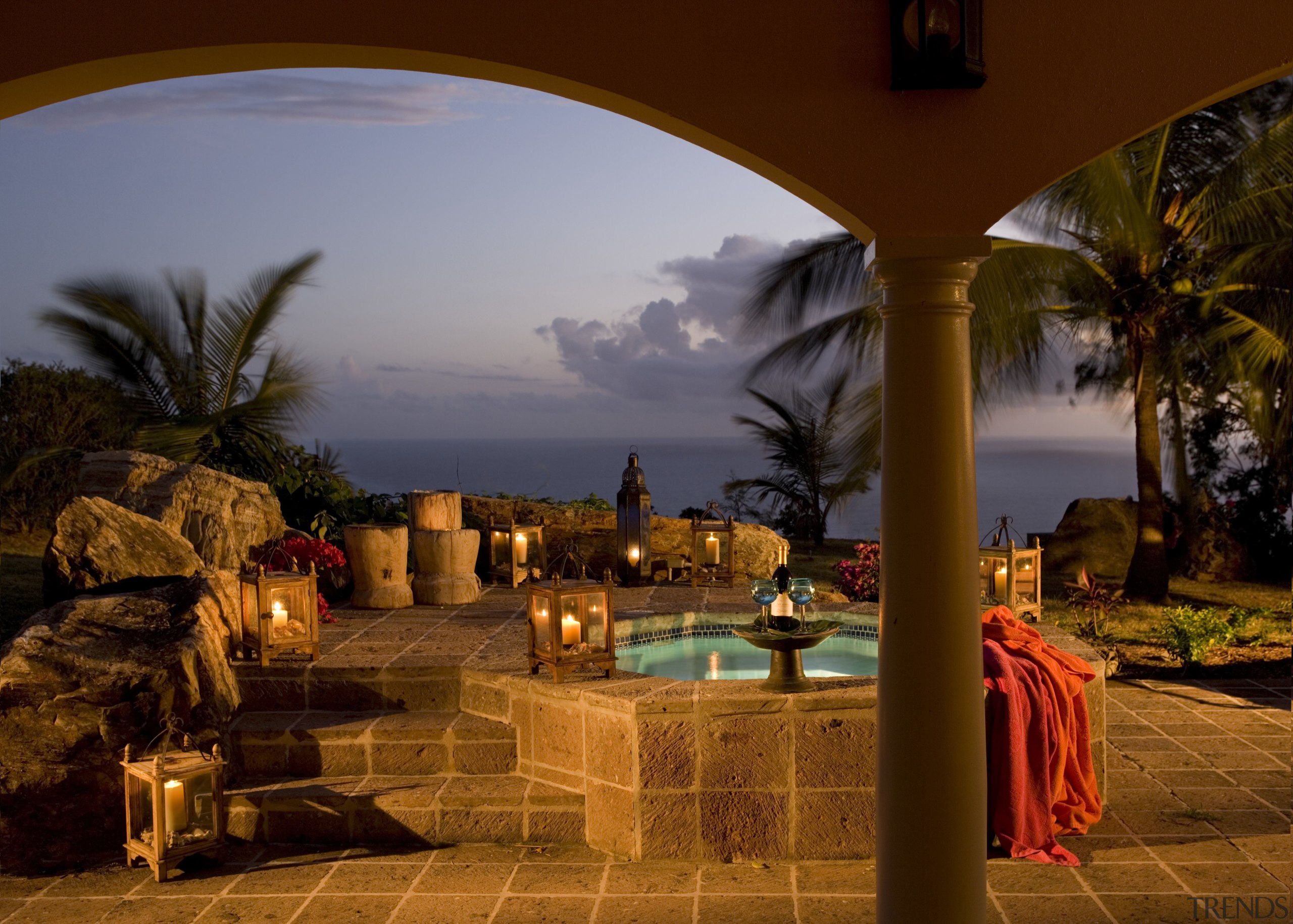Exterior view of patio features arches &amp; spa arecales, evening, hacienda, landscape lighting, lighting, palm tree, reflection, resort, sky, water, red, brown