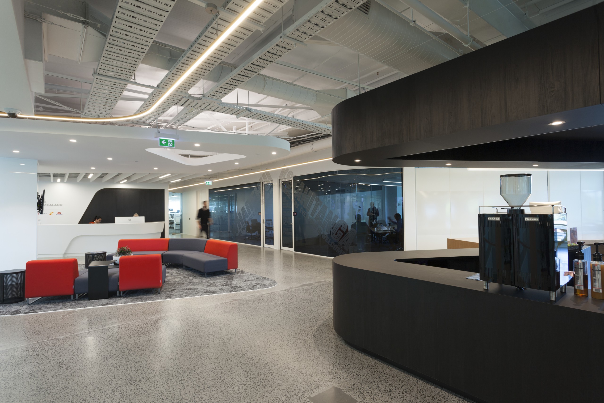 In a fit-out thats about inclusivity and transparency, ceiling, interior design, lobby, office, gray, black