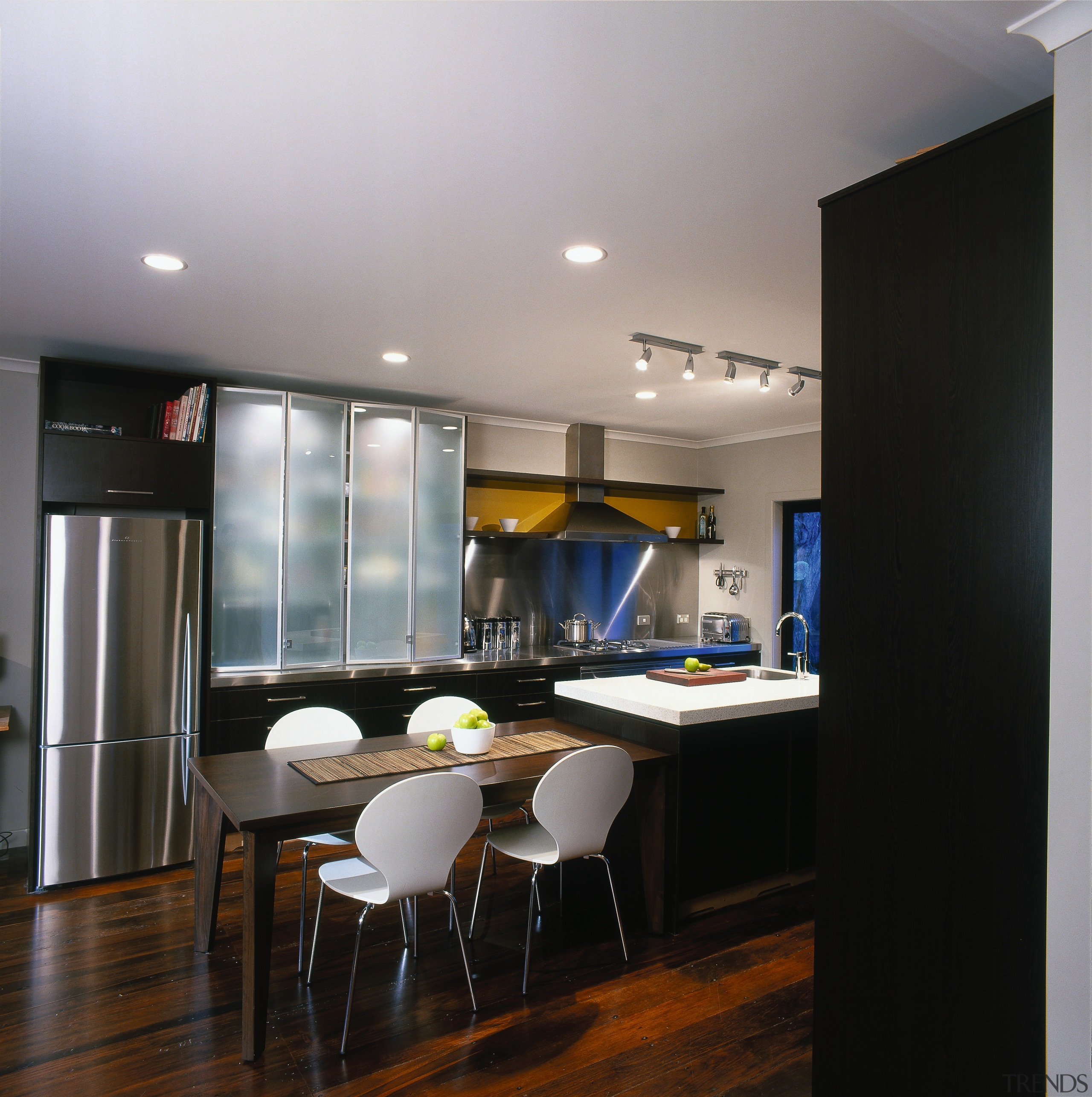 Kitchen with stainless steel benchtops and splashbacks, rangehood, ceiling, countertop, dining room, interior design, kitchen, real estate, room, table, gray, black
