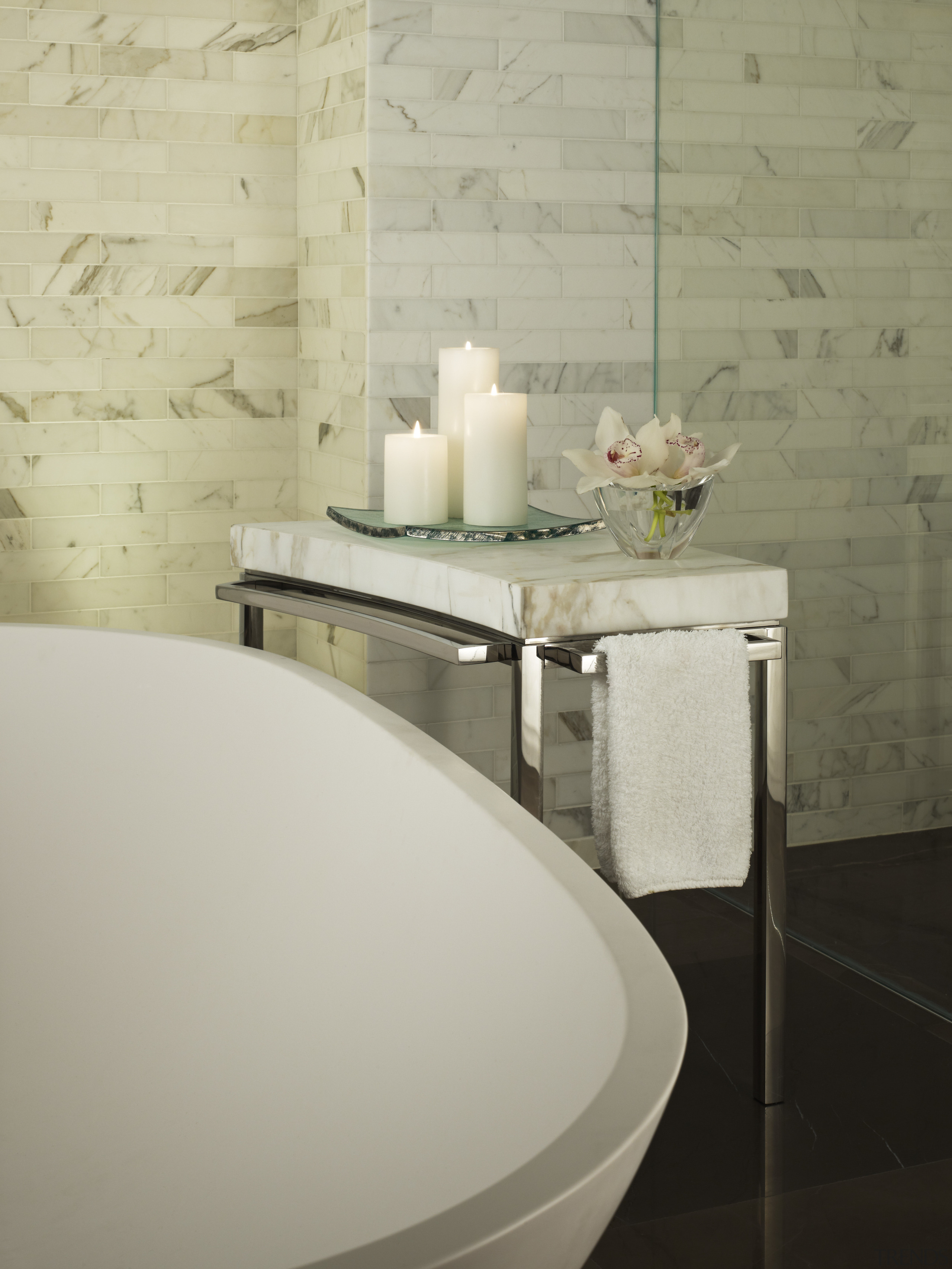 Designer, Mick De Giulio designed this marble side bathroom, bathroom sink, bidet, ceramic, floor, flooring, furniture, interior design, plumbing fixture, product design, room, sink, table, tap, tile, toilet seat, wall, gray