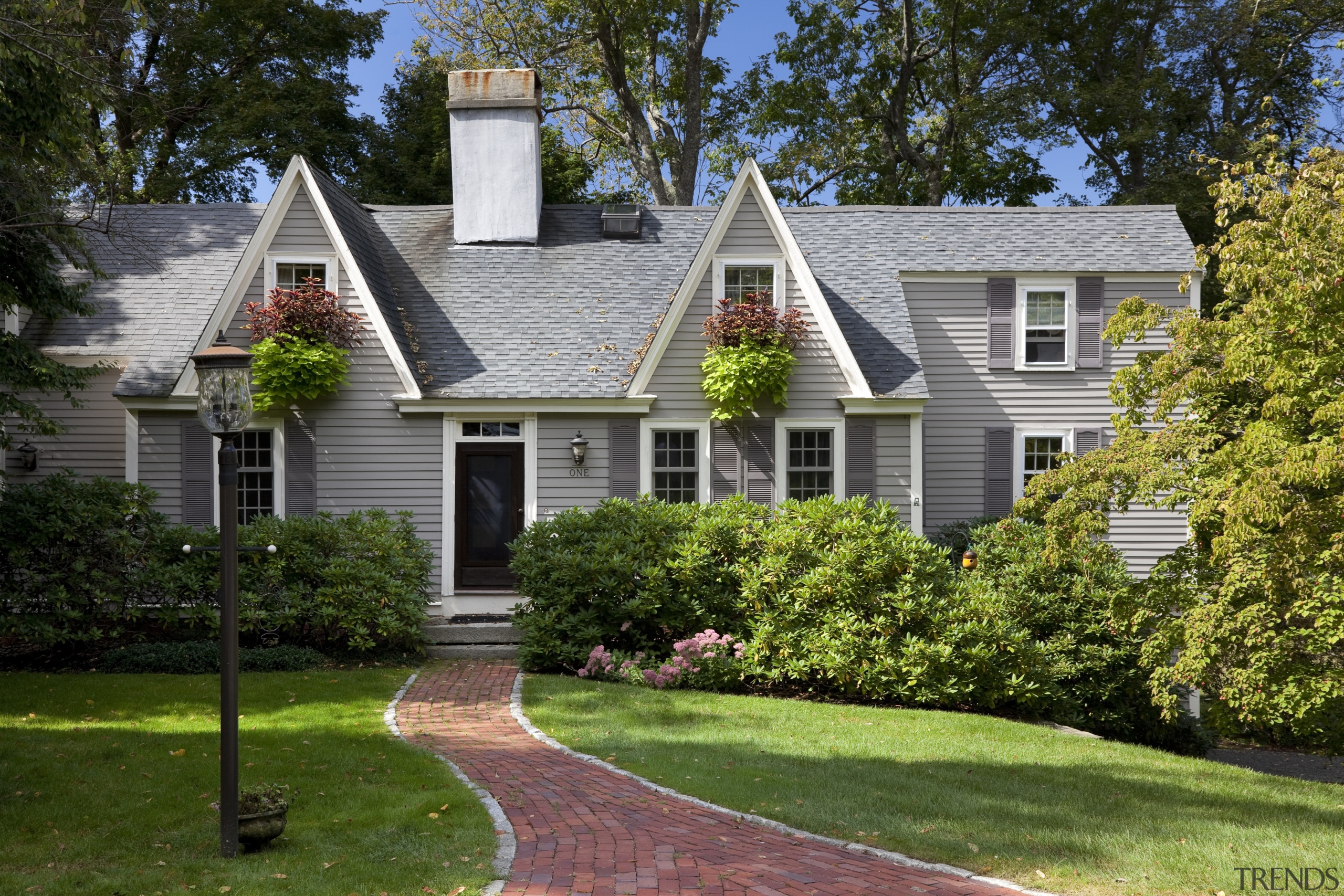 This Cape Cod-style residence was built in 1768, backyard, cottage, estate, farmhouse, historic house, home, house, landscape, landscaping, lawn, mansion, neighbourhood, outdoor structure, property, real estate, residential area, roof, siding, suburb, tree, window, yard, brown