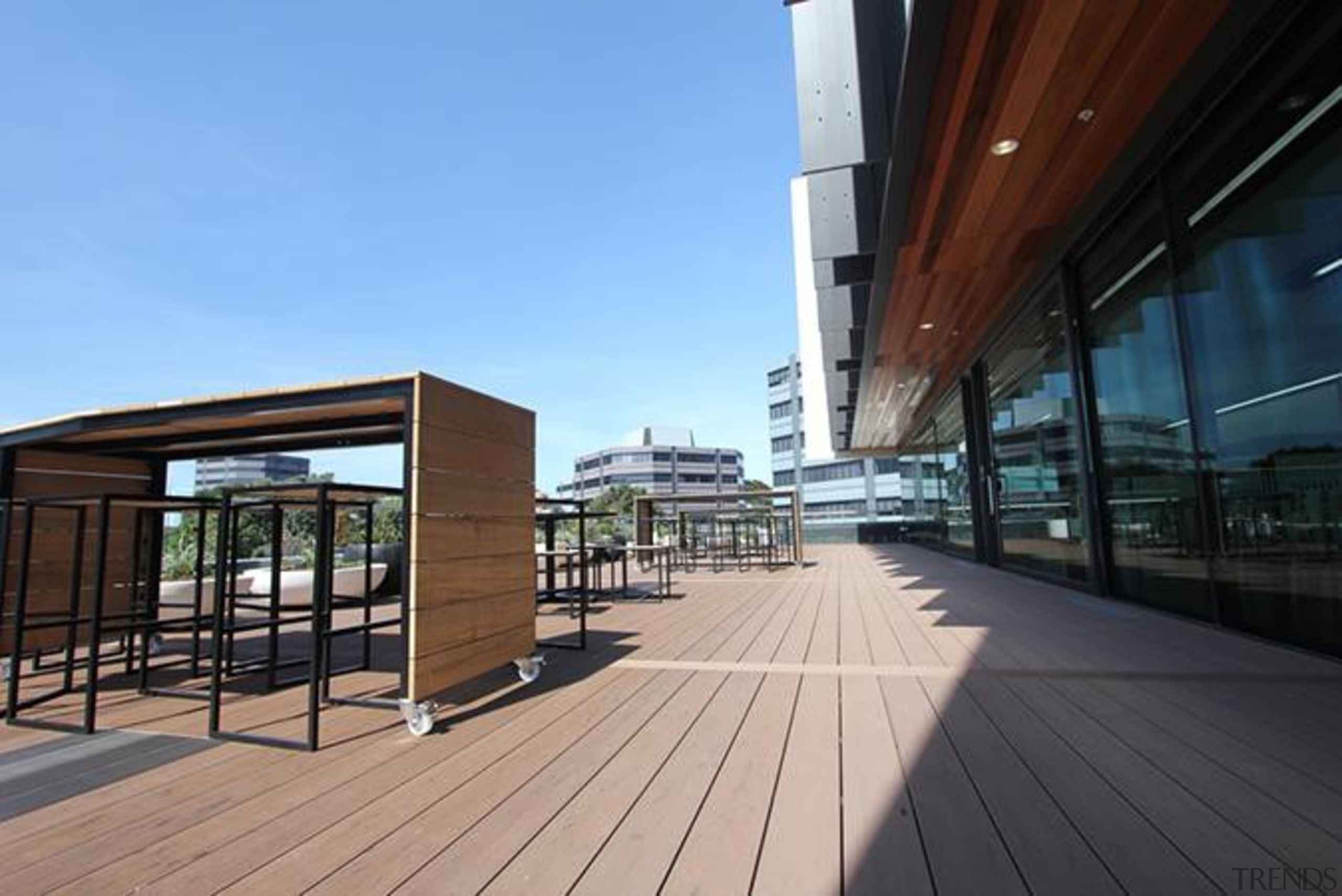 This large beautiful staff decking facility was build architecture, boardwalk, deck, house, mixed use, real estate, sky, walkway, wood, black, teal