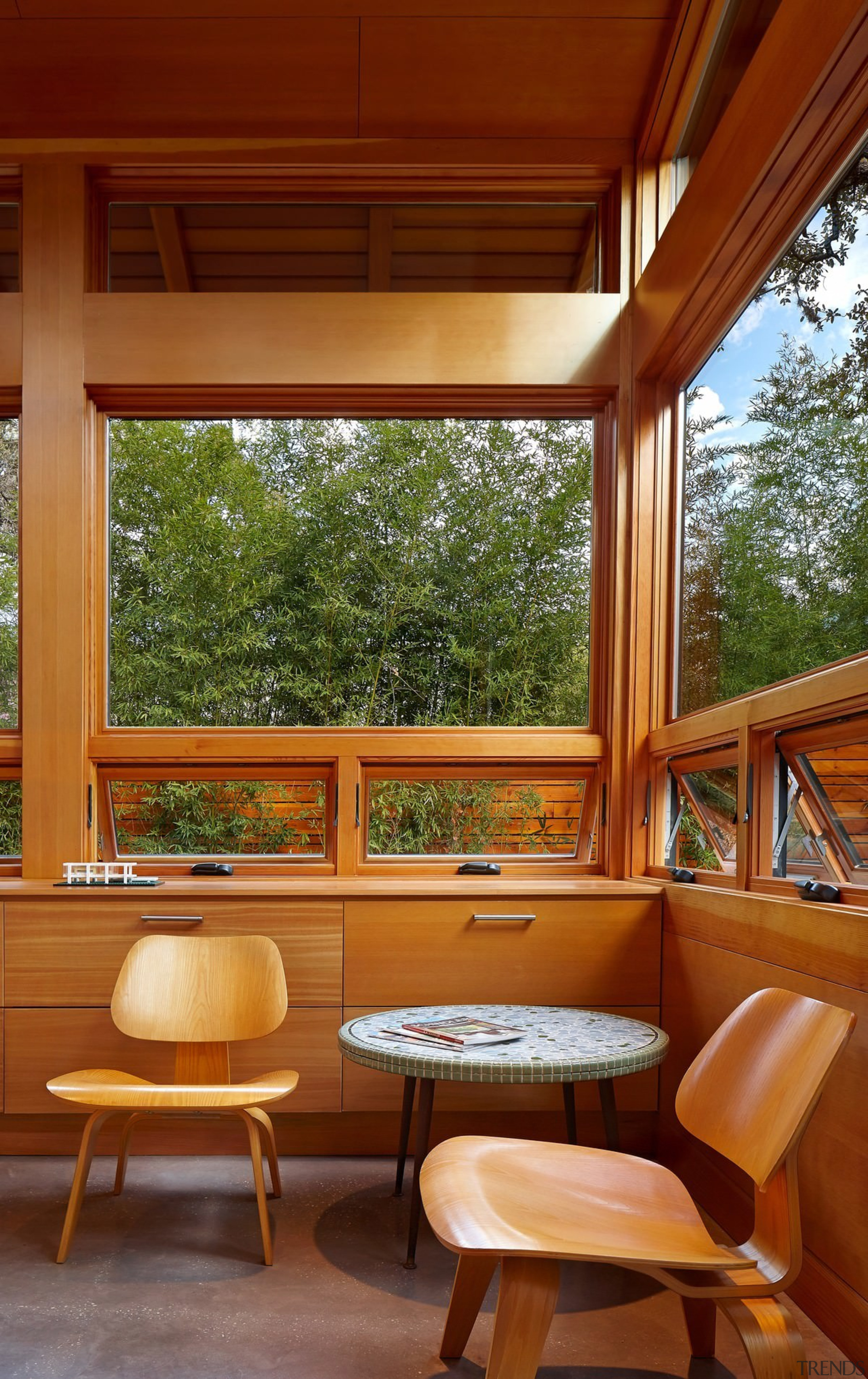 The windows in this space connect the room architecture, deck, furniture, home, house, interior design, living room, outdoor structure, porch, real estate, table, window, wood, brown