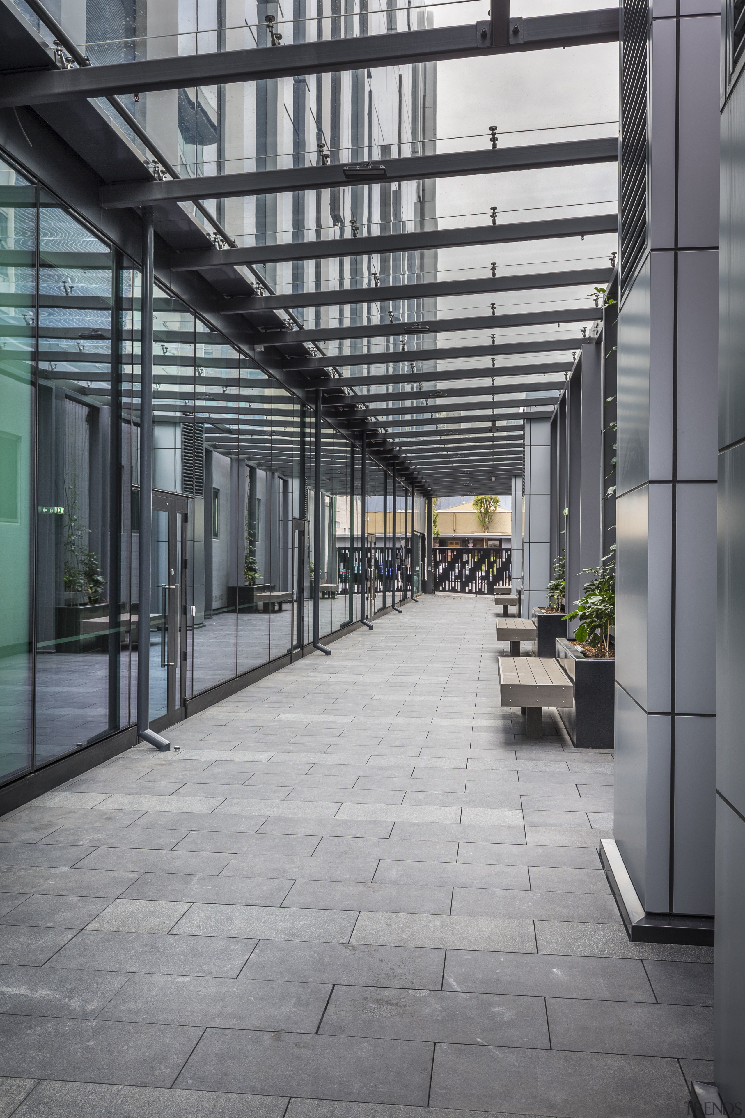 This glassed over laneway separates 2 Graham St architecture, building, condominium, daylighting, facade, glass, structure, walkway, gray, black