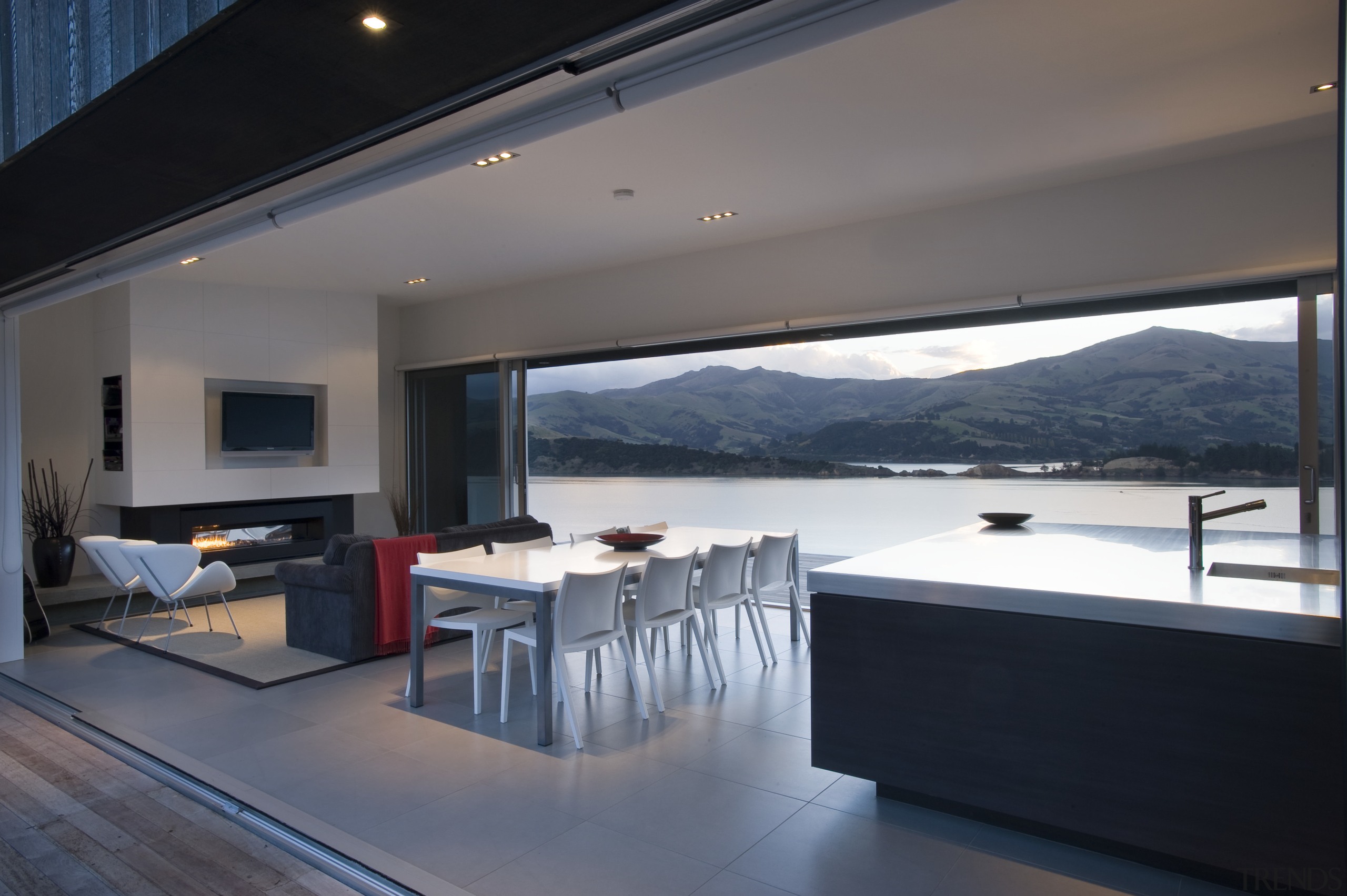 View of open-plan living, kitchen and dining area, architecture, floor, house, interior design, living room, penthouse apartment, property, real estate, window, gray, black