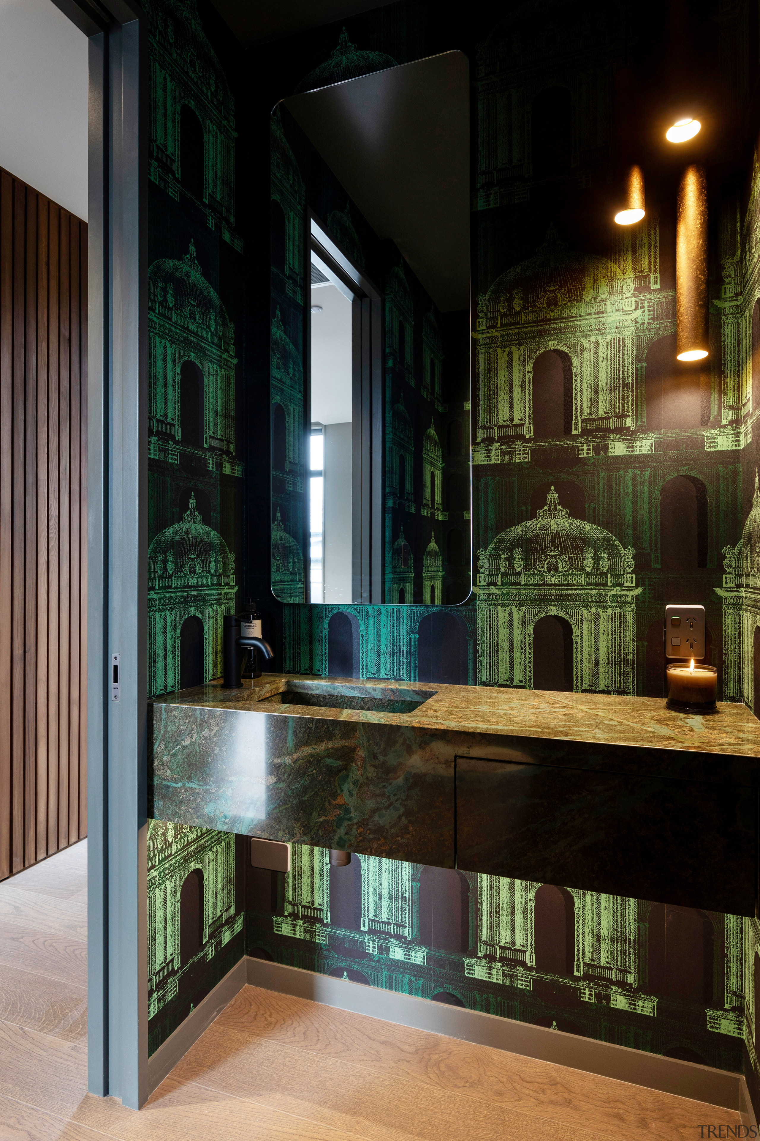 This powder room combines old-world architecture wallpaper with 