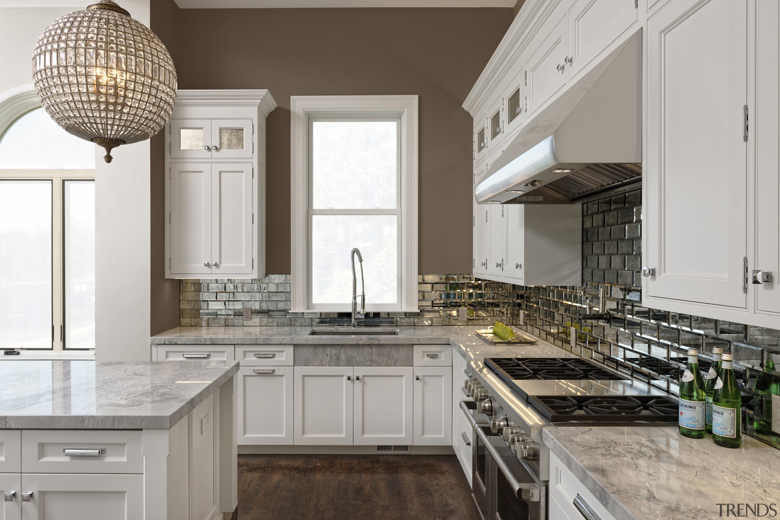 Antiqued mirror tiles back this cooking zone and cabinetry, countertop, cuisine classique, home, interior design, kitchen, gray