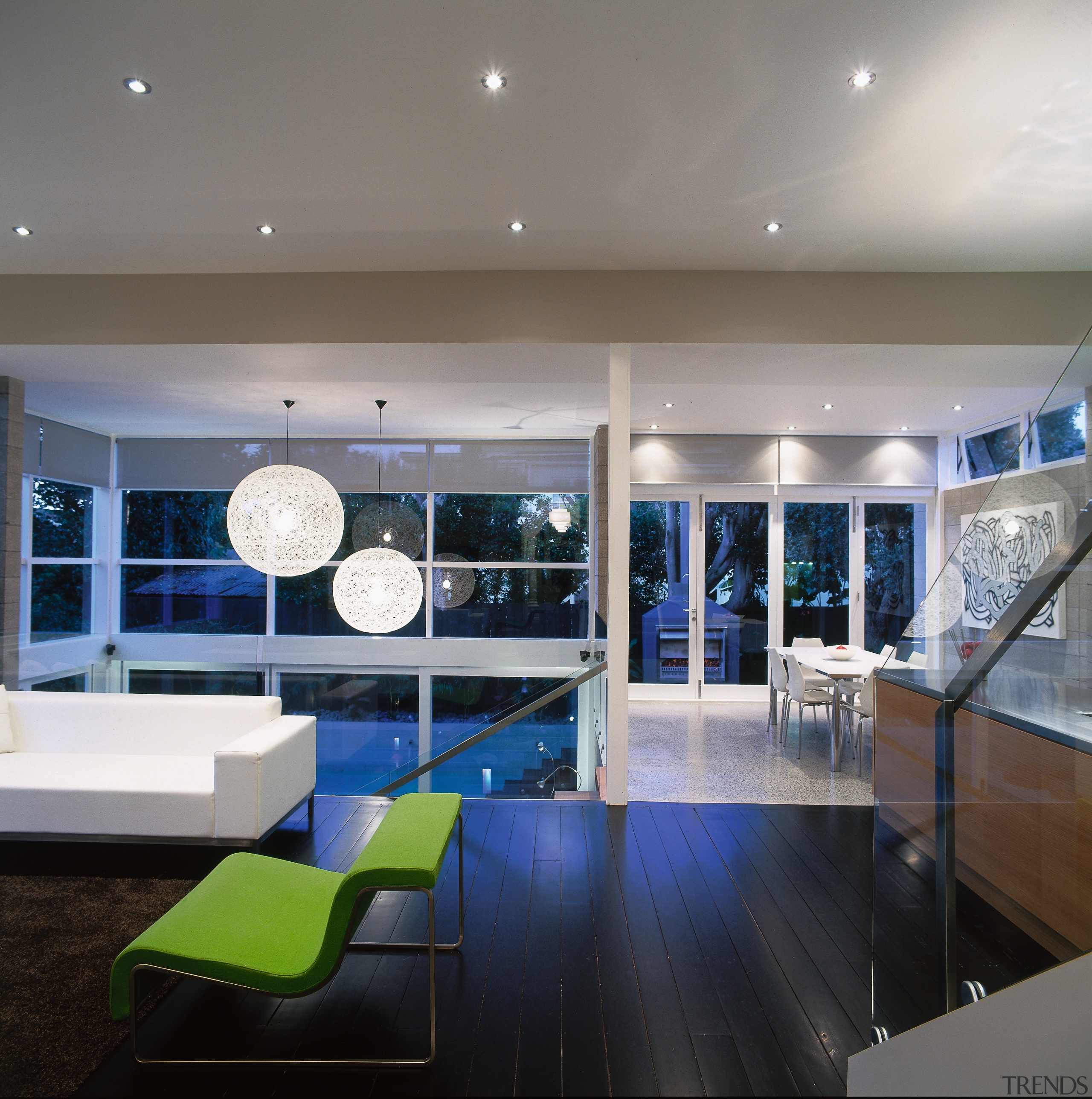 view of the open plan living area featuring architecture, ceiling, interior design, lighting, living room, lobby, gray